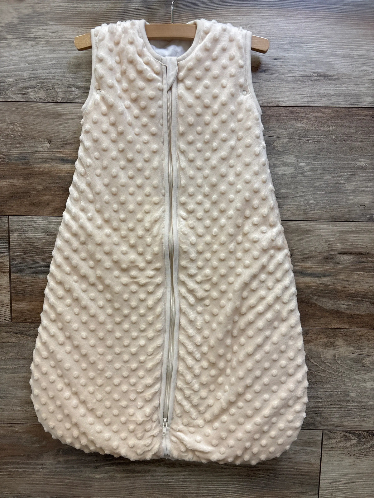 BabyInABag yellow plush minky dot sleep sack with zipper on a wooden background