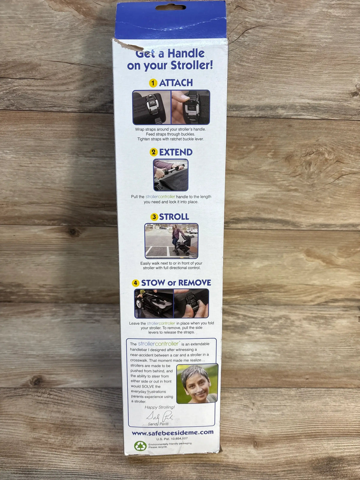 Front of Baby Stroller Controller box showing headline Get a Handle on your Stroller and four-step instructions (attach, extend, stroll, stow) on wood