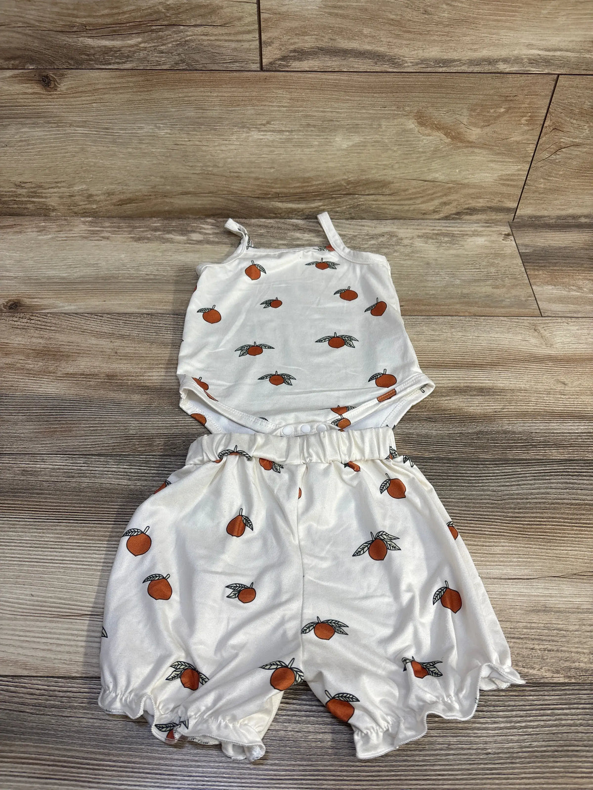 Ivory Shein 2-piece baby tank bodysuit and shorts set with orange fruit print