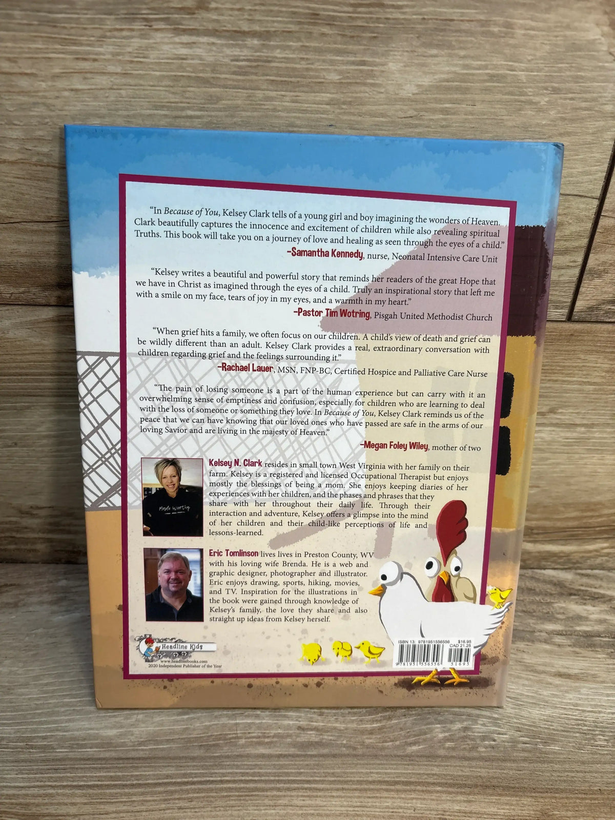 Back cover of Because of You hardcover children's book showing author bio and review quotes with illustrated hen and three chicks on a wooden surface