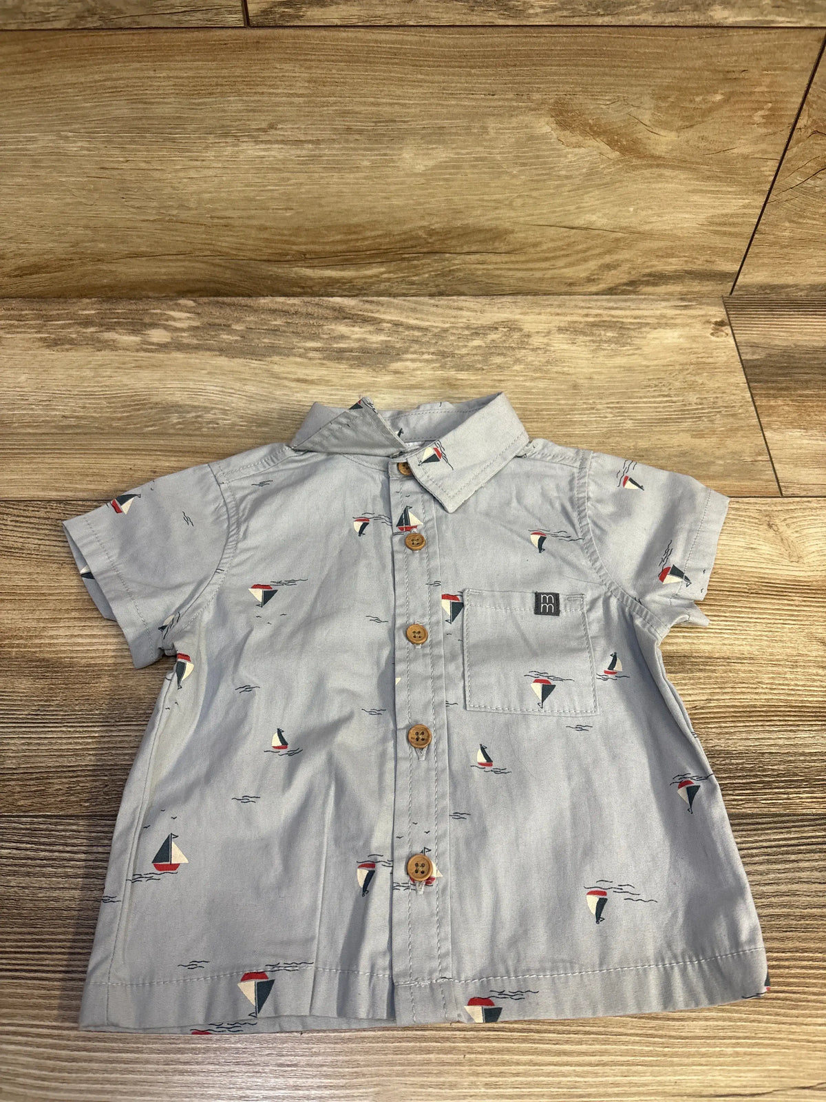 Modern Moments blue button up shirt for infants with a sailboat print
