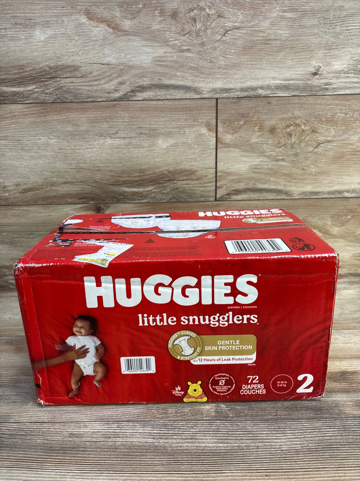 Huggies Little Snugglers Size 2 diapers box on wood floor, 72 count, red packaging