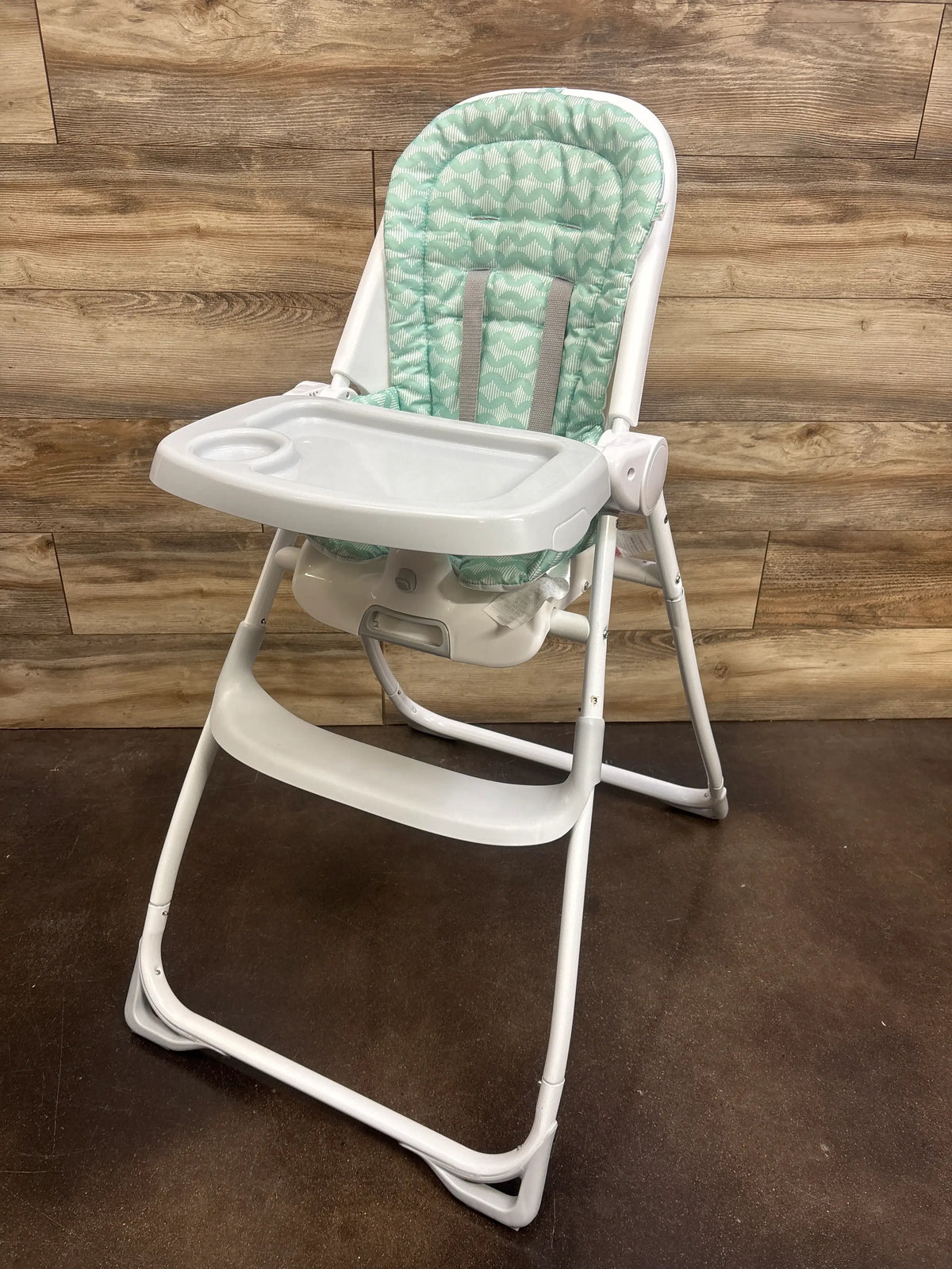 Front view of Ity by Ingenuity Yummity Yum Easy Folding High Chair in Goji with padded patterned seat and tray