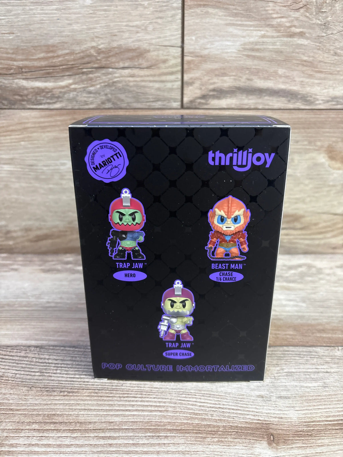 Back view of Masters of the Universe Trap Jaw vinyl figure box showing Hero, Beast Man Chase 1/6 Chance, and Super Chase designs