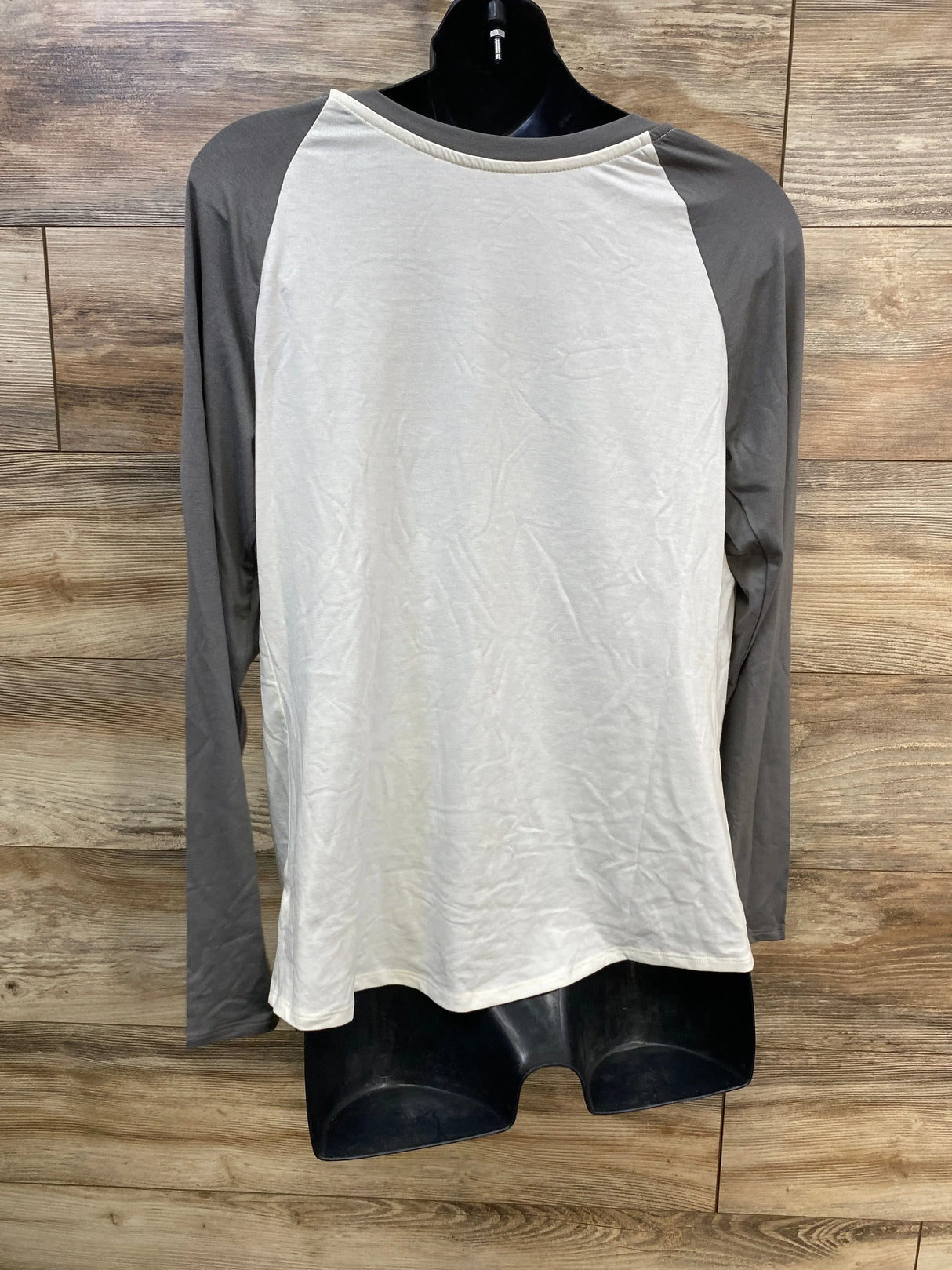 White and gray long sleeve raglan maternity top on mannequin, ideal for pregnancy comfort and style.