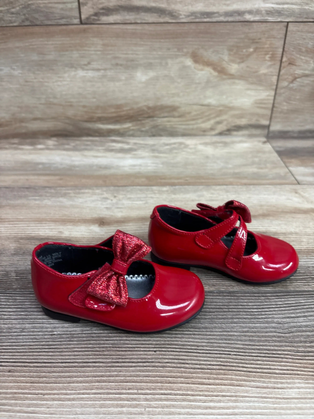 Pair of red patent leather Mary Jane bow flats for toddlers by Me n Mommy To Be