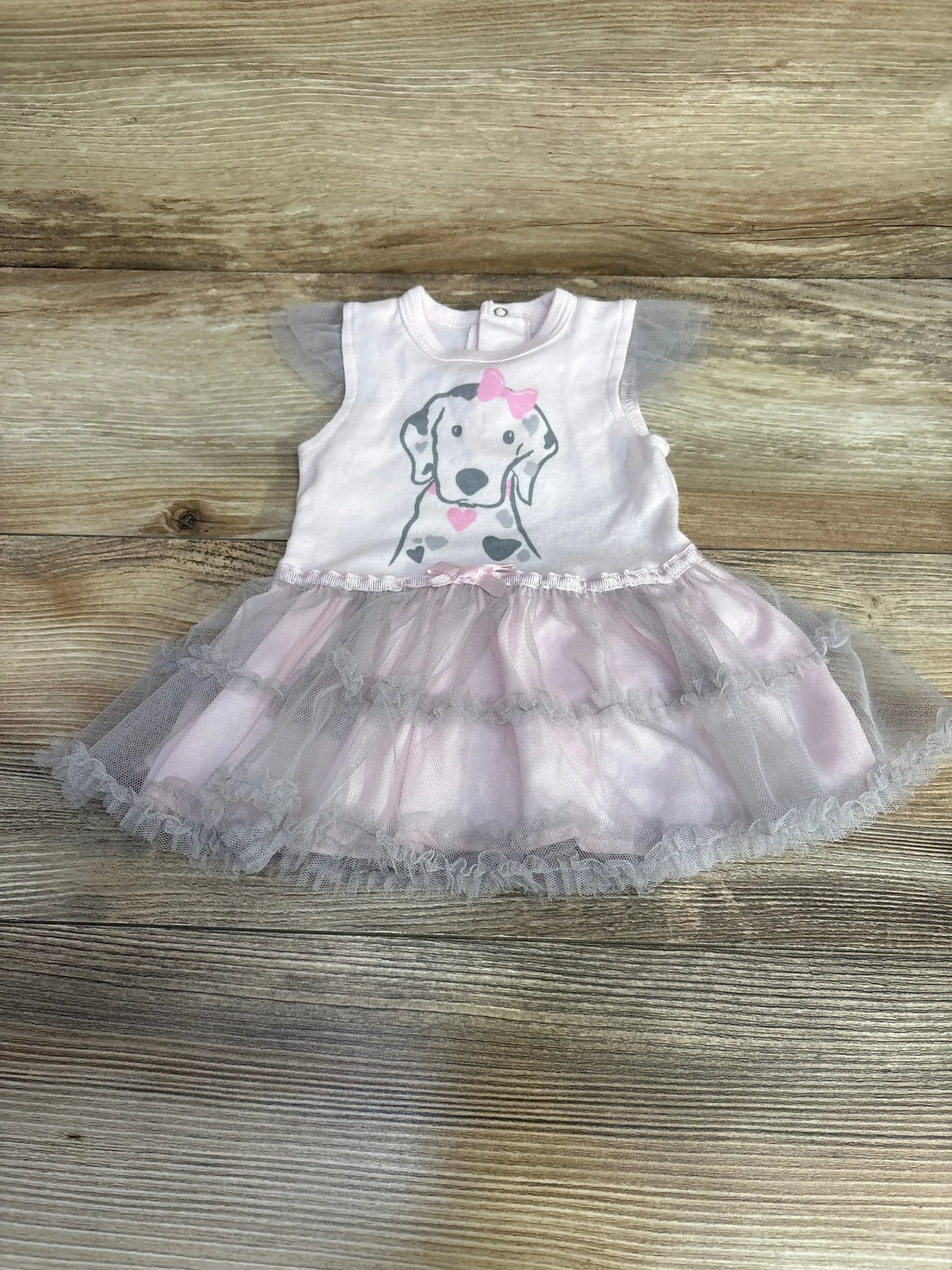 Front view of pink Rene Rofe tutu bodysuit dress (0-3M) showcasing layered tulle skirt and snap-closure onesie on white background