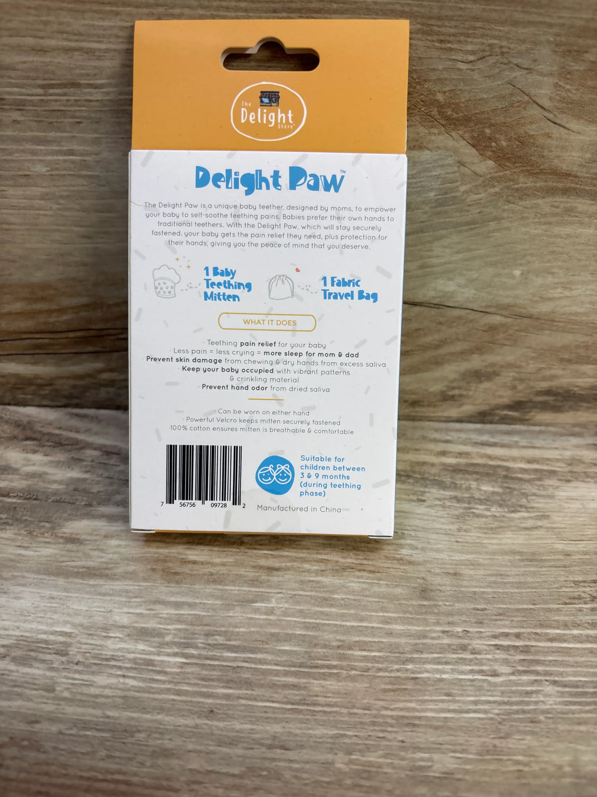 Back of Delight Paw baby teething mitten package showing one mitten, fabric travel bag, and suitability for ages 3 to 9 months