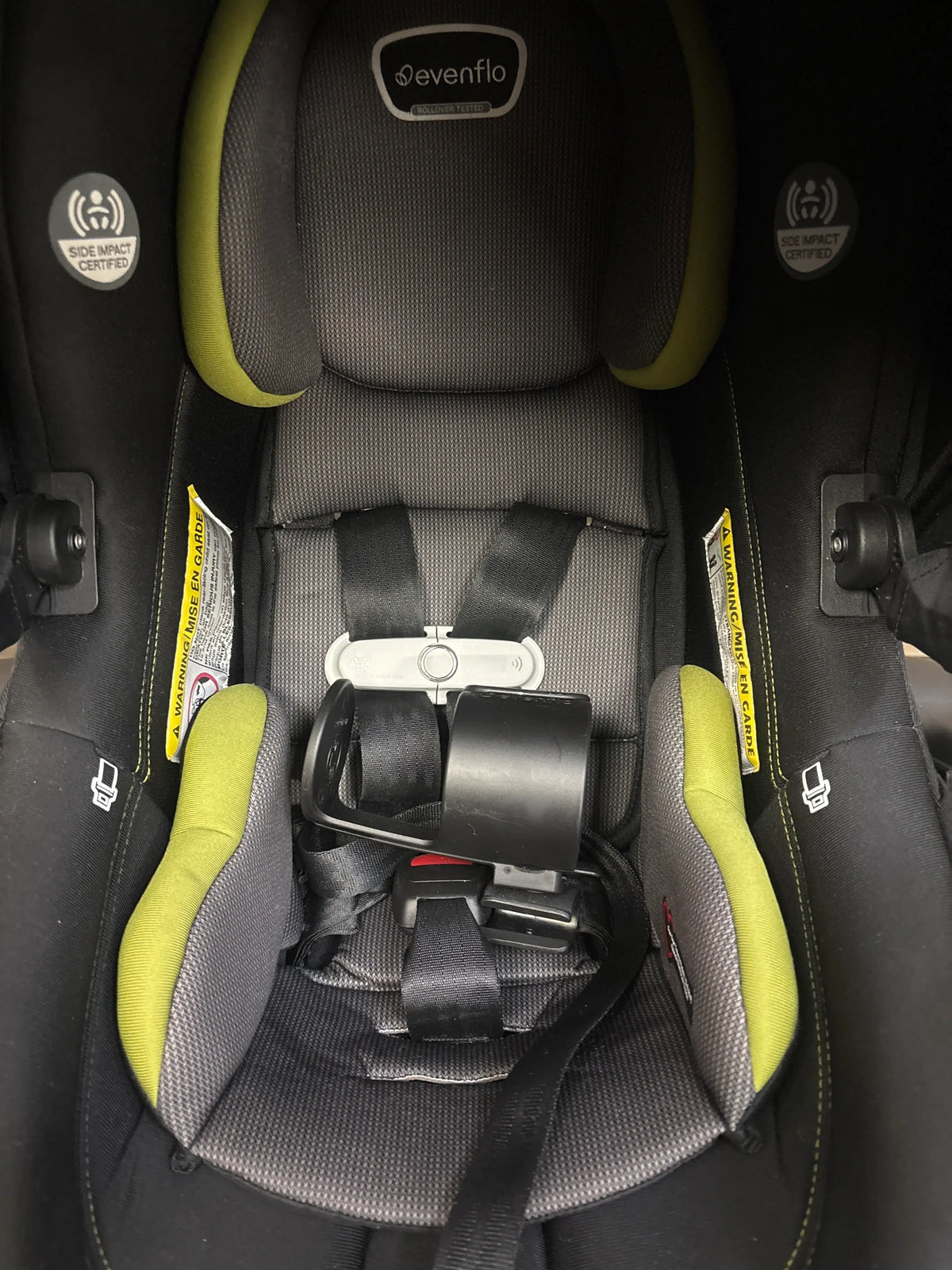 Front view of Evenflo Shyft DualRide Travel System in Durham Green showcasing its padded harness seat
