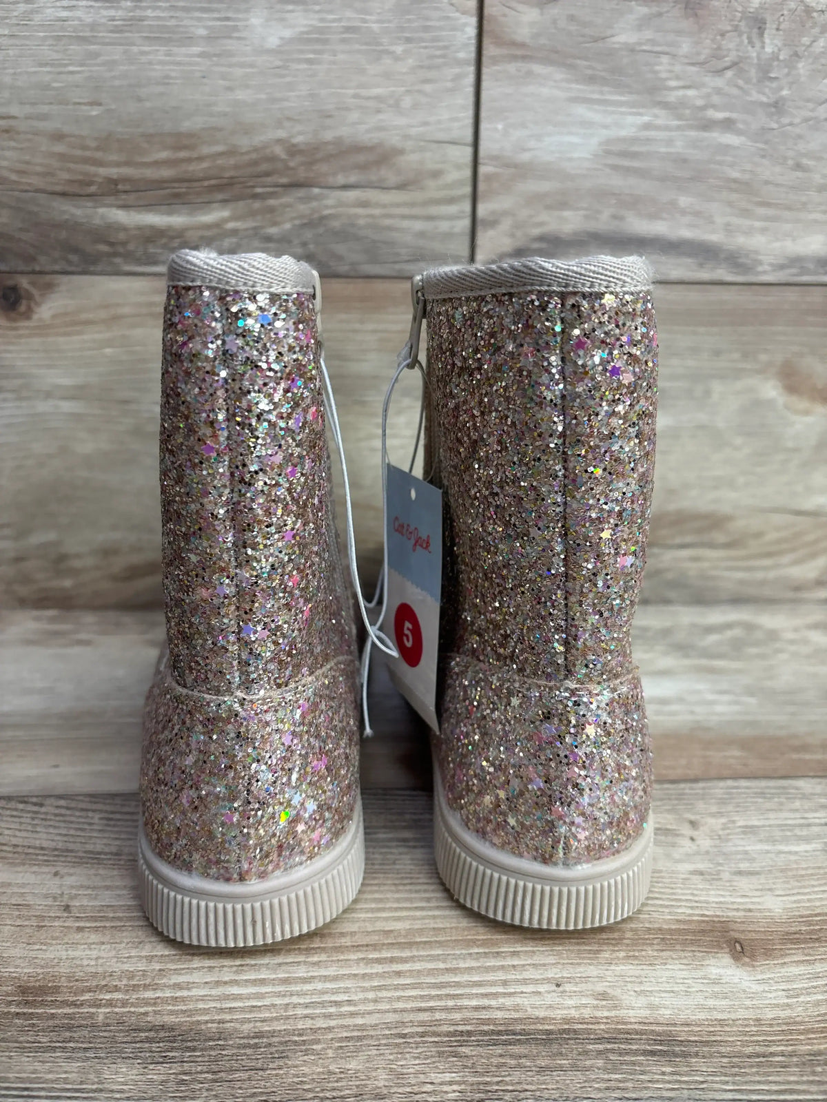 Sparkly glitter toddler boots size 5 on wood background, kids footwear resale