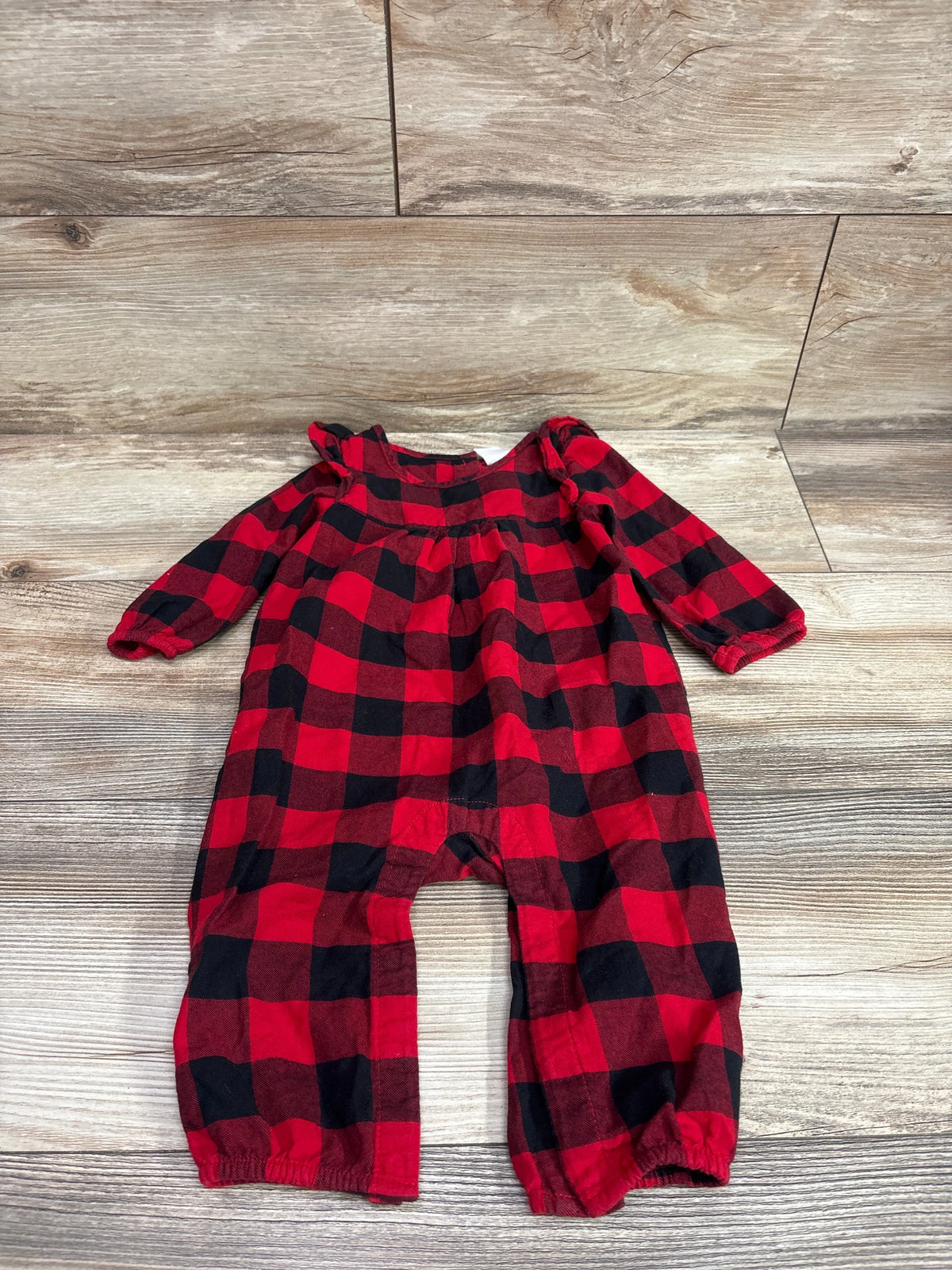 Baby Gap red and black buffalo plaid coverall for infants 6-12m on a wood background