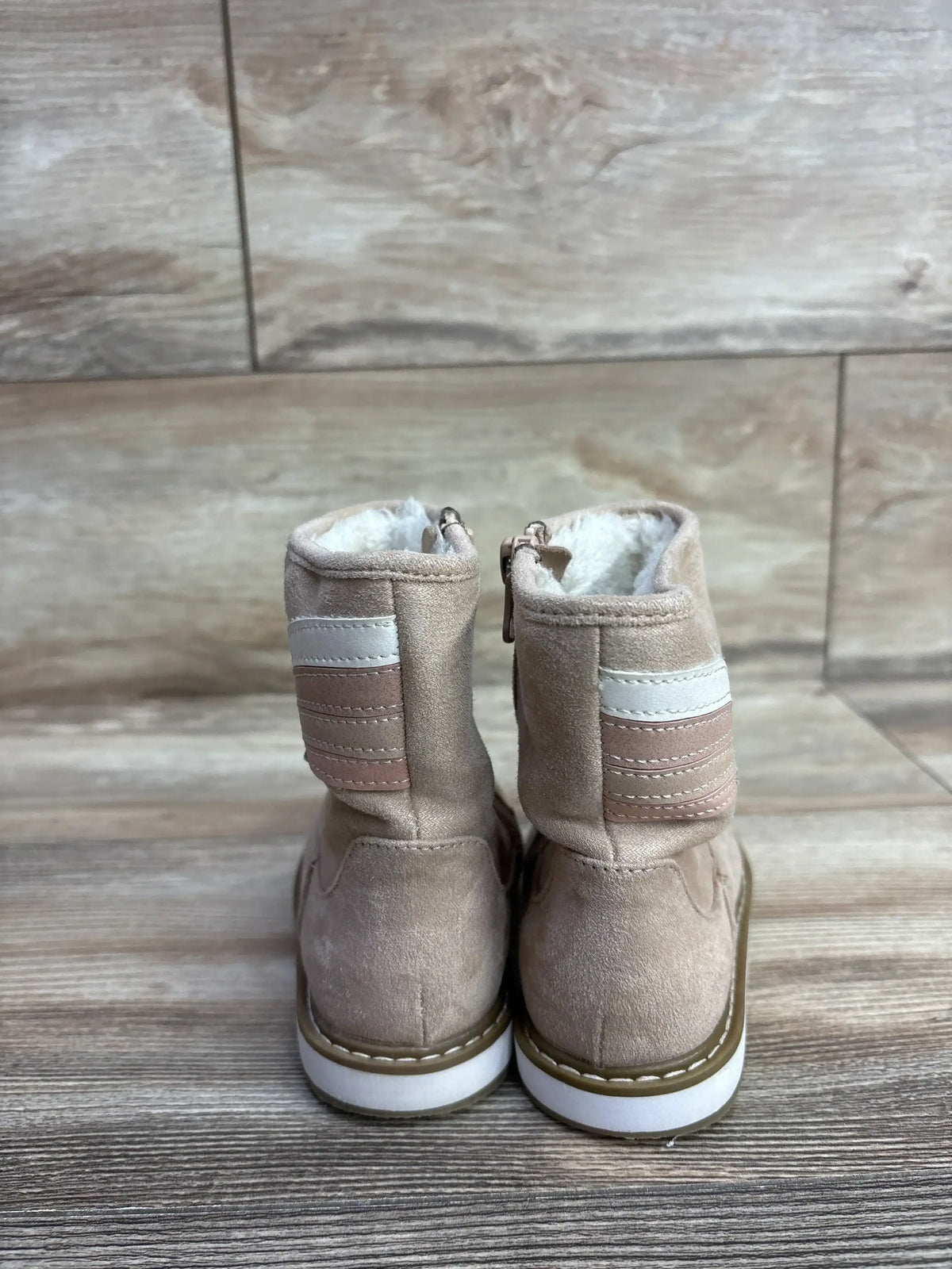 Back view of tan suede toddler boots with pink and white stripes, cozy fur lining