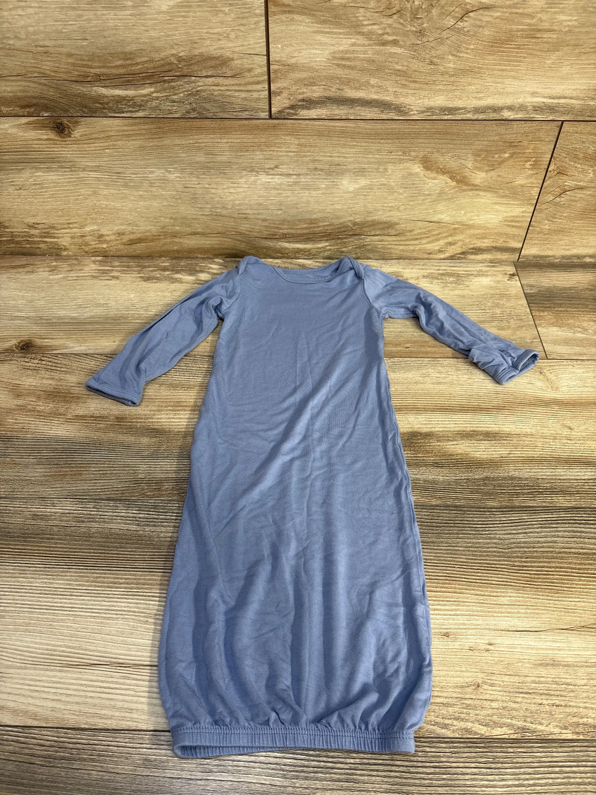 Front view of blue Just One You ComfySoft sleep gown showcasing long sleeves and elasticized hem on wood floor
