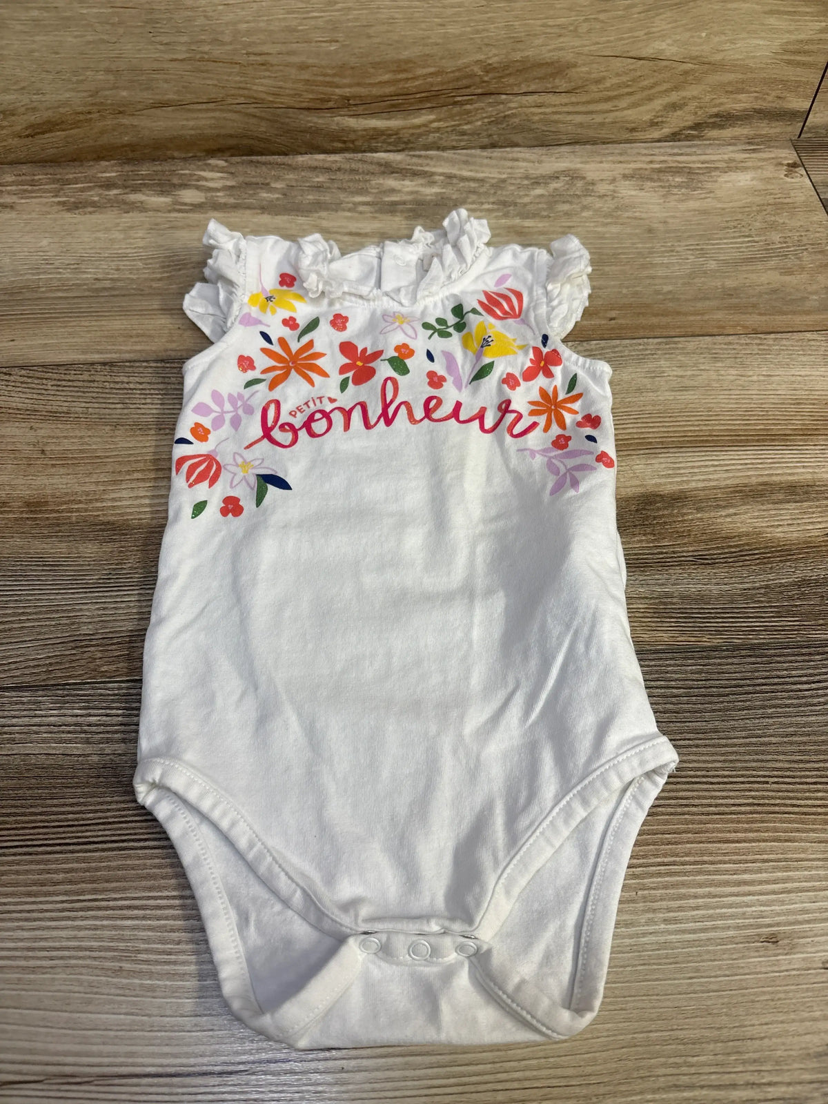 White Me n Mommy To Be baby bodysuit with floral embroidery and 'bonheur' text