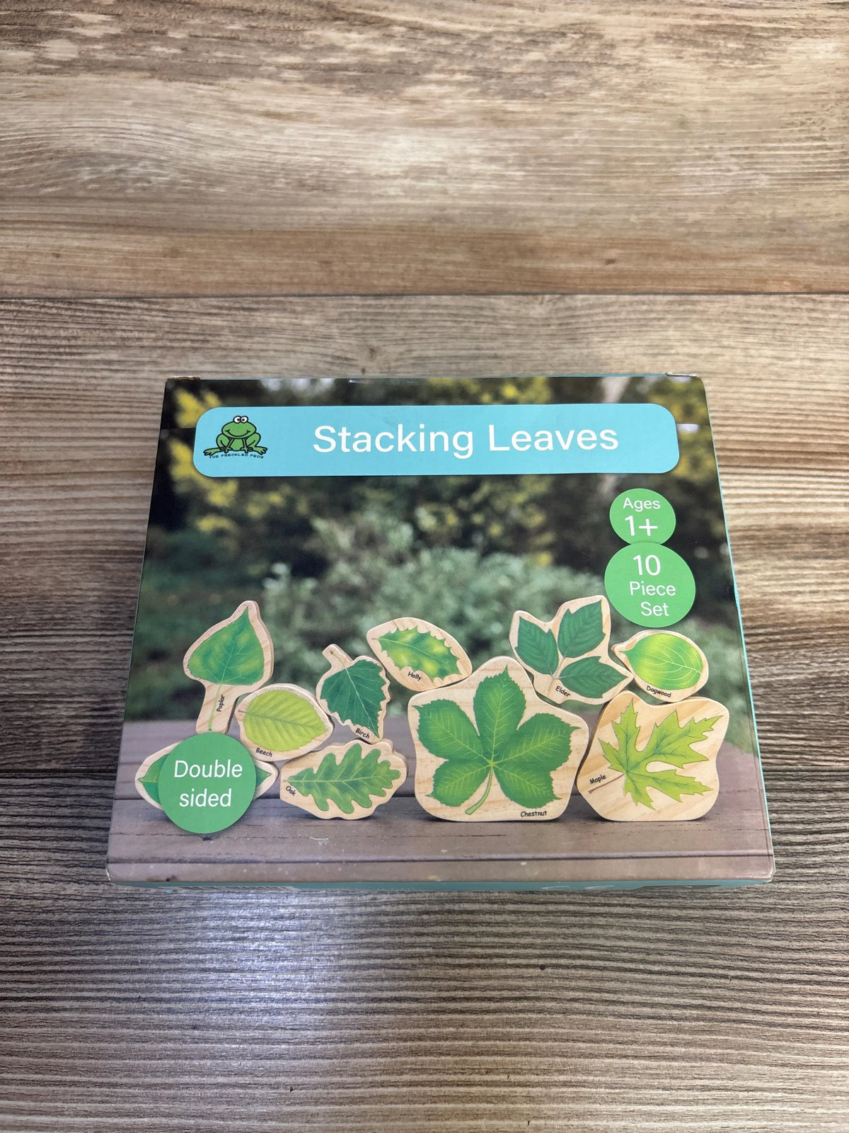 Front view of The Freckled Frog Stacking Leaves 10pc set with illustrated wooden leaf blocks, double sided 10 piece set
