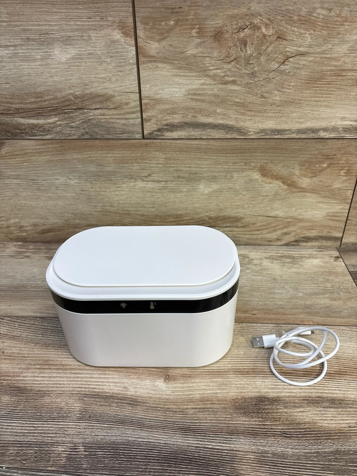 Front view of ZJchao USB baby wipes heater showing rounded white lid, black indicator band and USB cable on wood background