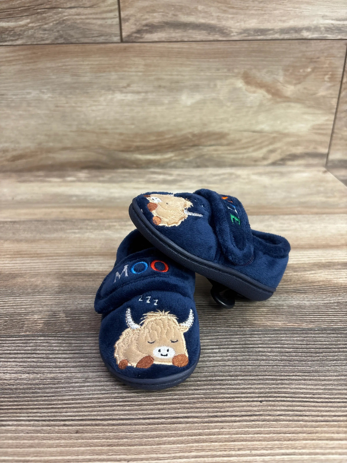 Navy blue Wonder Nation Moo nite slippers for kids featuring an embroidered highland cow.