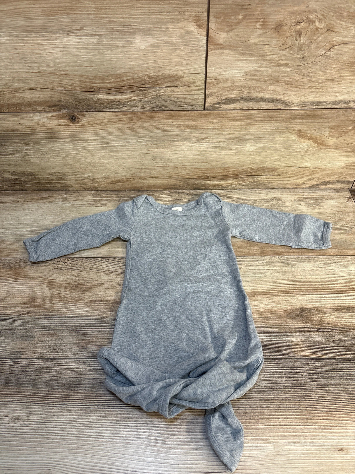 Gray long sleeve knotted baby gown on wooden floor, infant sleepwear, kids clothing resale