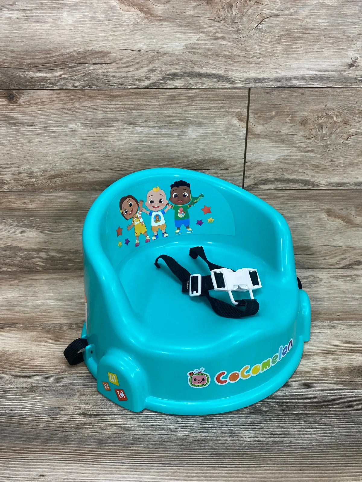 Three-quarter view of Cocomelon 15 Inch children’s table chair and floor seat showing turquoise seat and secure straps