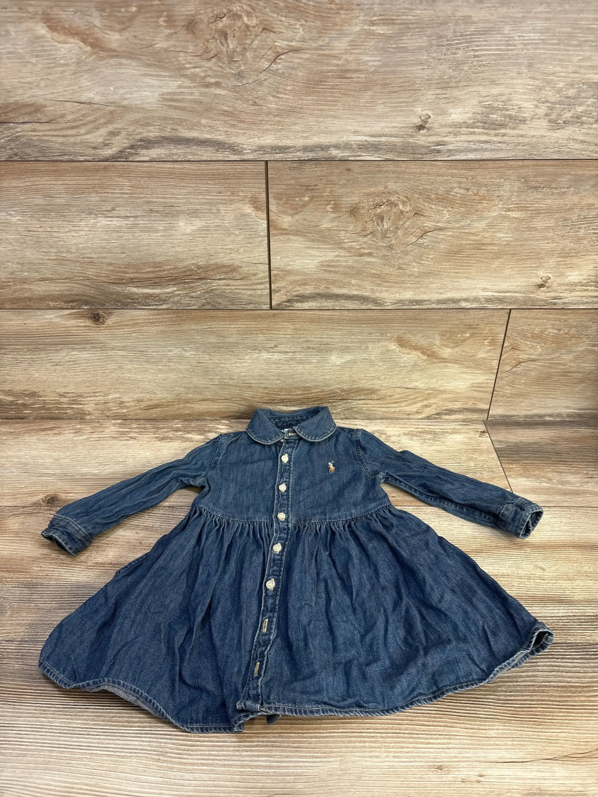Front view of blue Ralph Lauren denim shirtdress showing point collar, long sleeves, button-front closure, and pony embroidery
