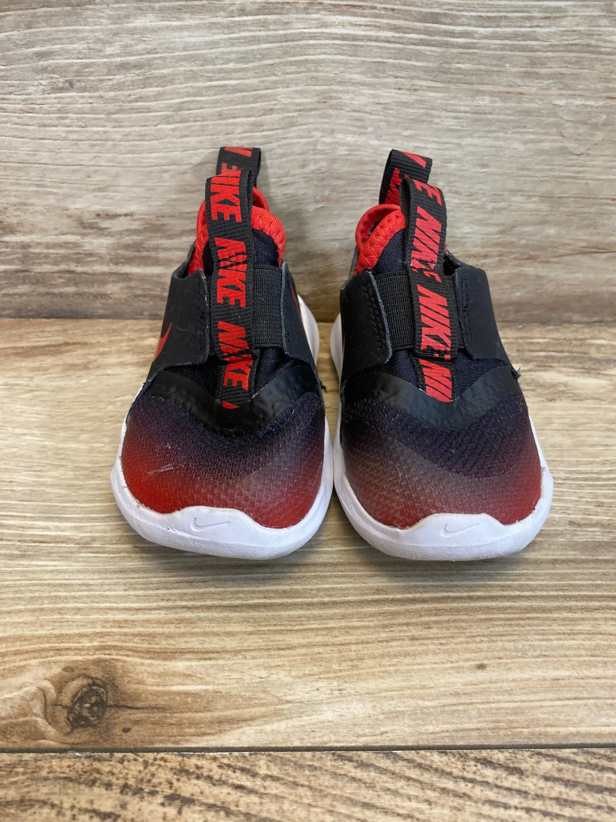 Front view of Flex Runner TD University Red Black sneakers showing gradient slip-on uppers and white soles