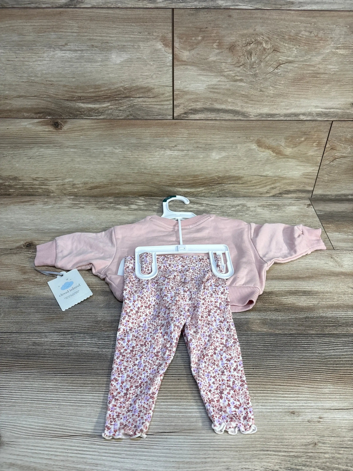 Pink baby sweater and floral print leggings set on hanger, Cloud Island brand, kids clothing