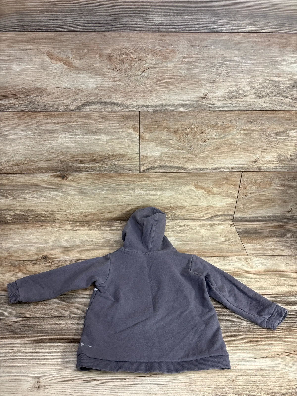Back of Cotton On Marvel Spider-Man hoodie, gray, 18-24 months, hood, ribbed cuffs, small white scuff on hem on wood floor