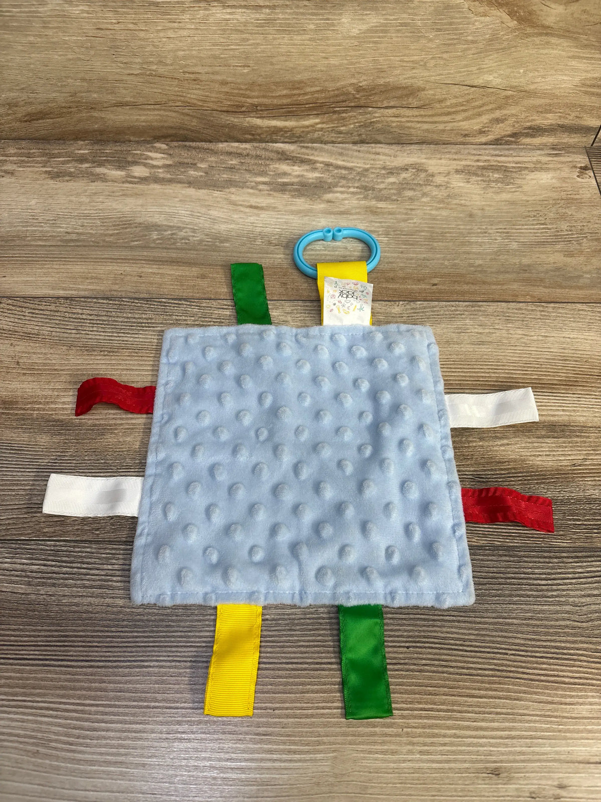 Jack & Co Learning Lovey NYC Tag Crinkle Sheet in light blue with colorful sensory tags