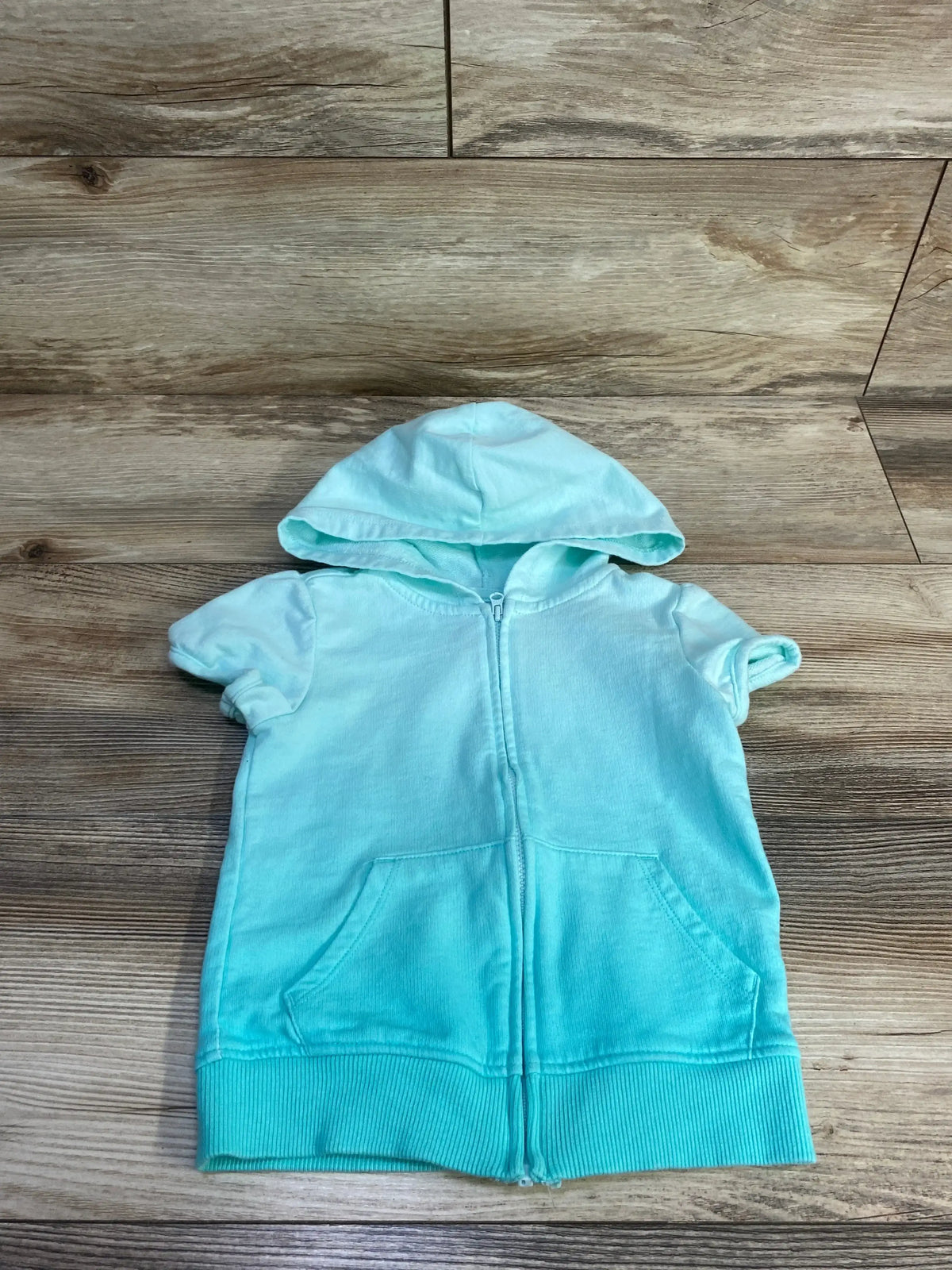 Front view of OshKosh B’gosh toddler hooded jacket in teal showing hood and zipper on white background, size 2T