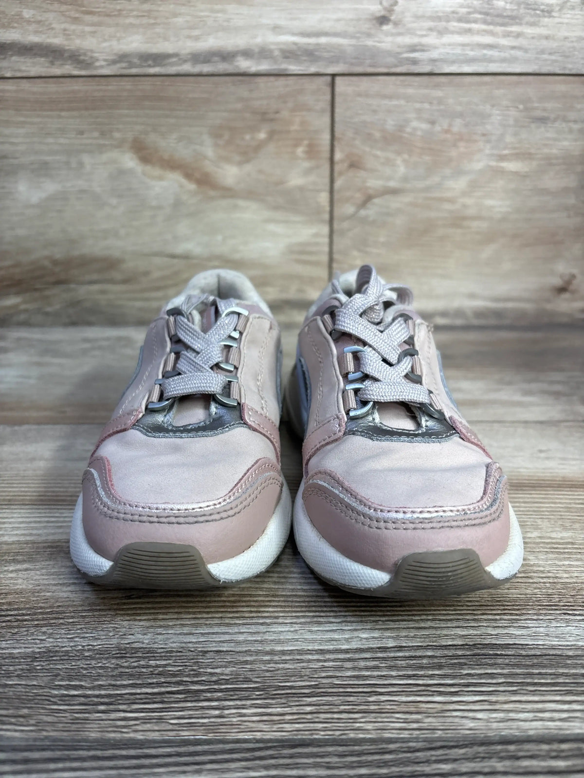 Front view of Mayoral Makeup Sneakers Pink sz 11c showcasing functional lace closure with a wood-look background