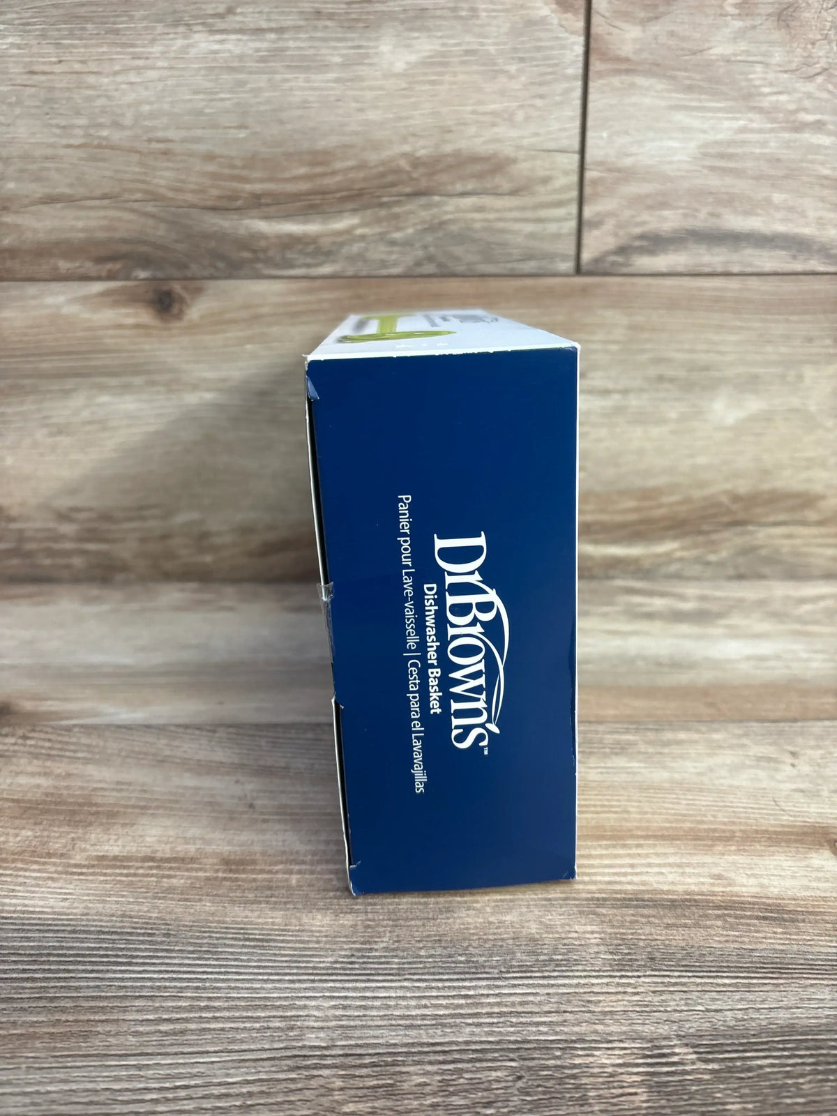 Side view of Dr. Brown's dishwasher basket box showing brand logo and Dishwasher Basket label on wood background