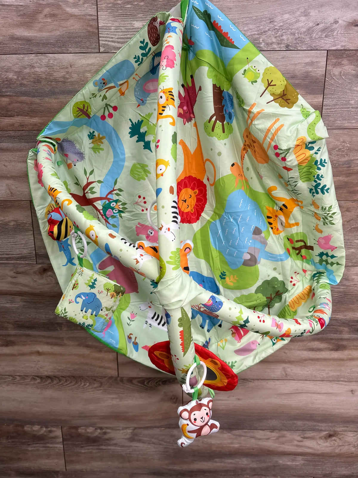 Lulunemo Animal Baby Activity Gym Playmat with colorful jungle print and hanging monkey toy
