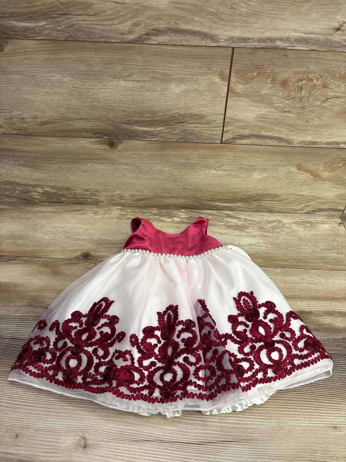 American Princess red velvet and white tulle baby dress with ornate burgundy lace embroidery
