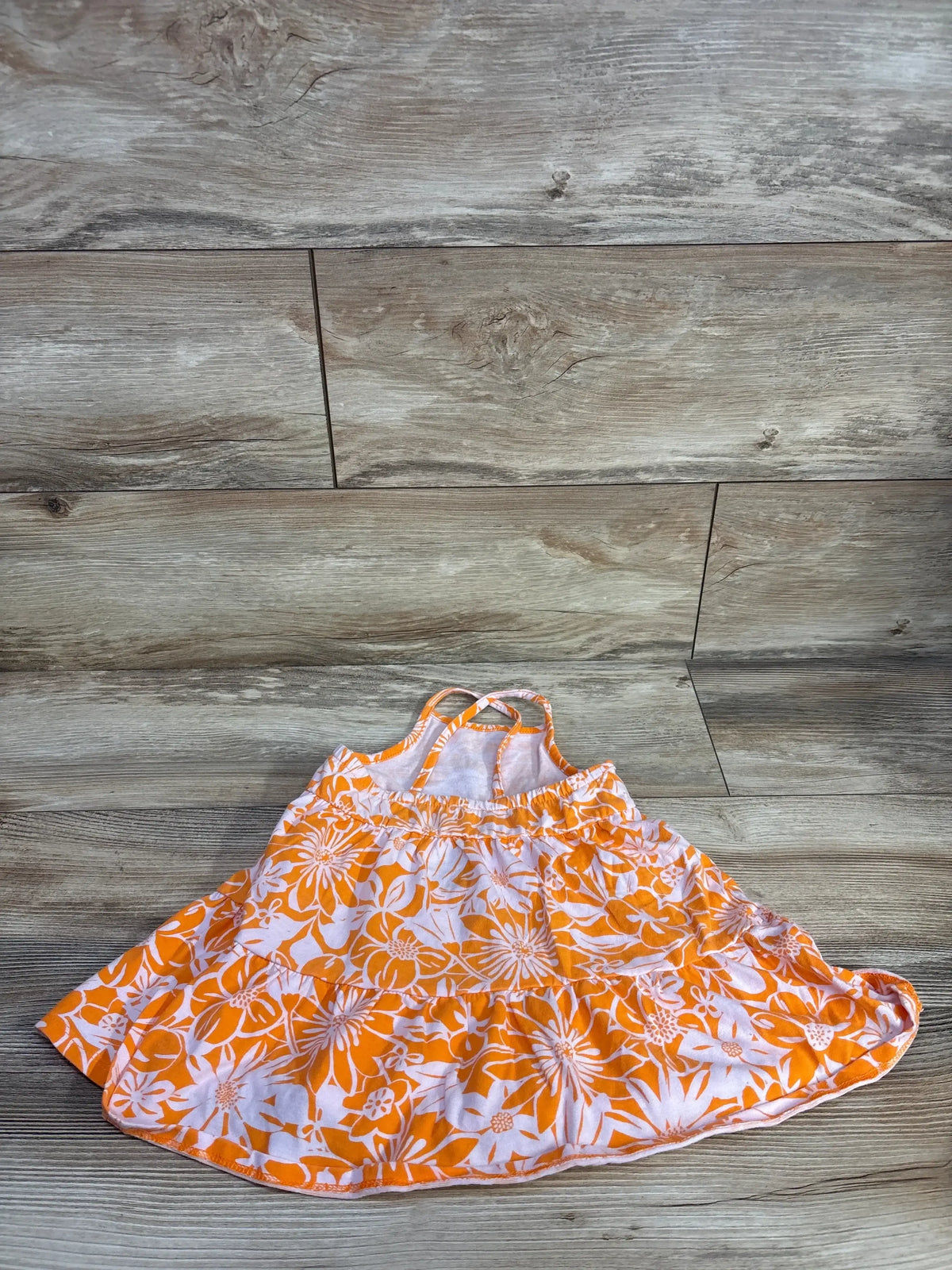 Flat-lay Cat & Jack orange floral tank dress 2T showing spaghetti straps, elastic waist and tiered skirt on light wood
