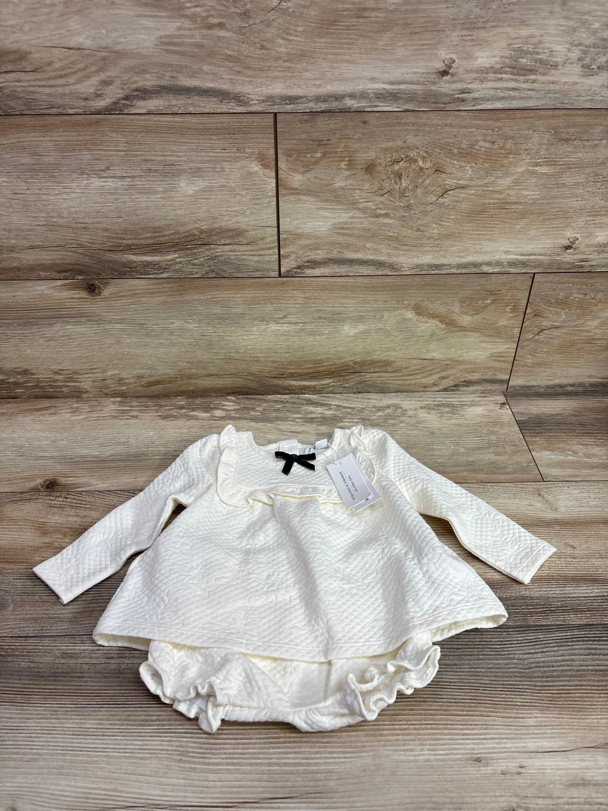 Janie & Jack cream quilted 2-piece baby set with a long-sleeve dress and matching bloomers.