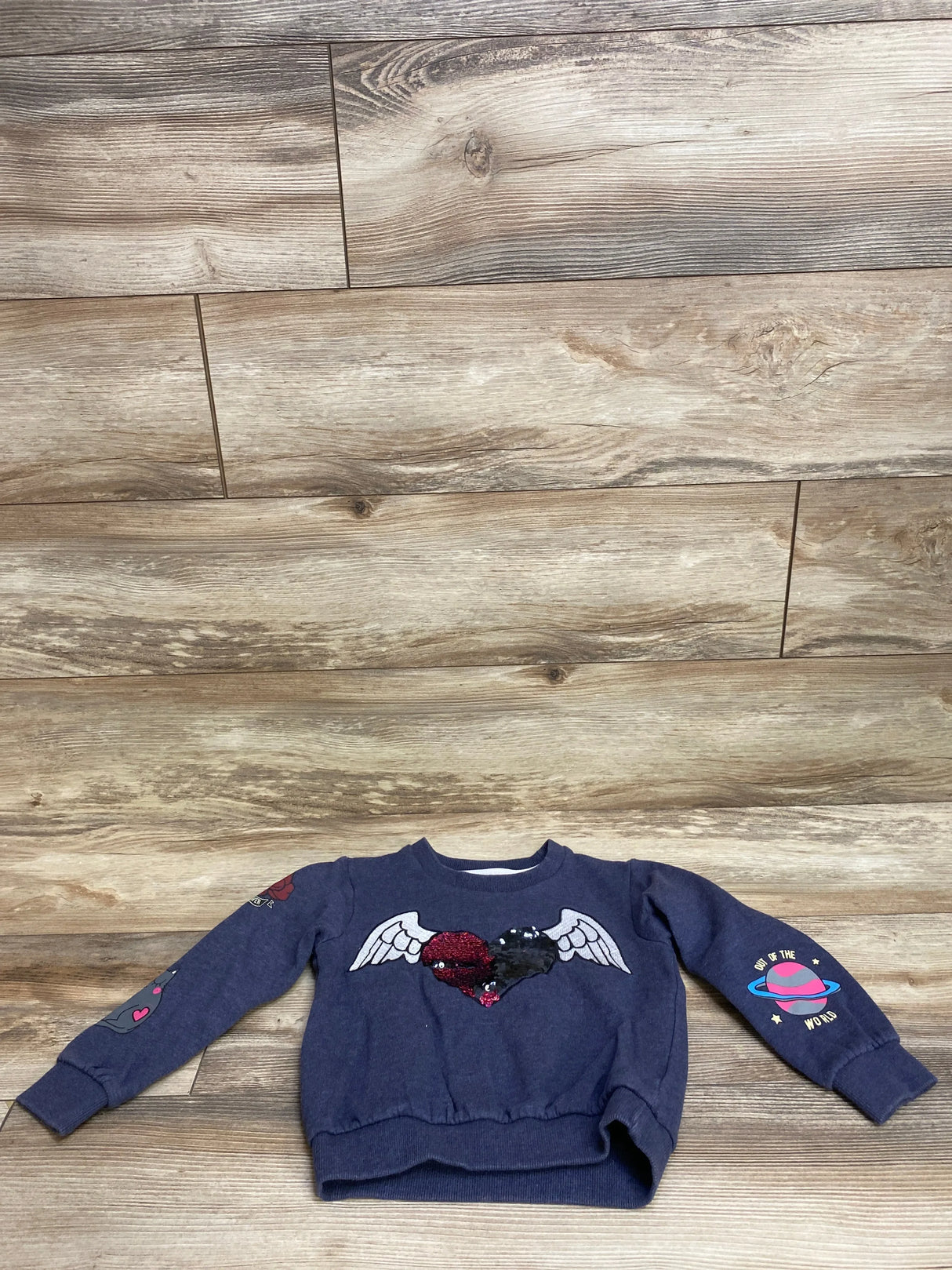 Navy blue children's sweatshirt with sequin heart and wings design, space and heart sleeve prints