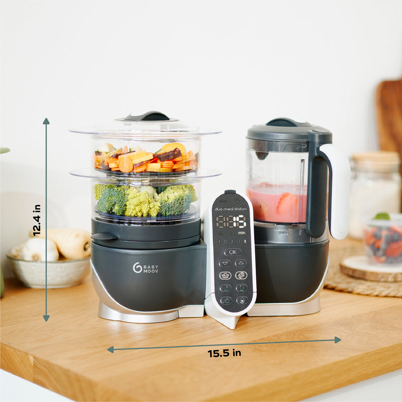Babymoov Duo Meal Station food processor with vegetables and puree on kitchen counter
