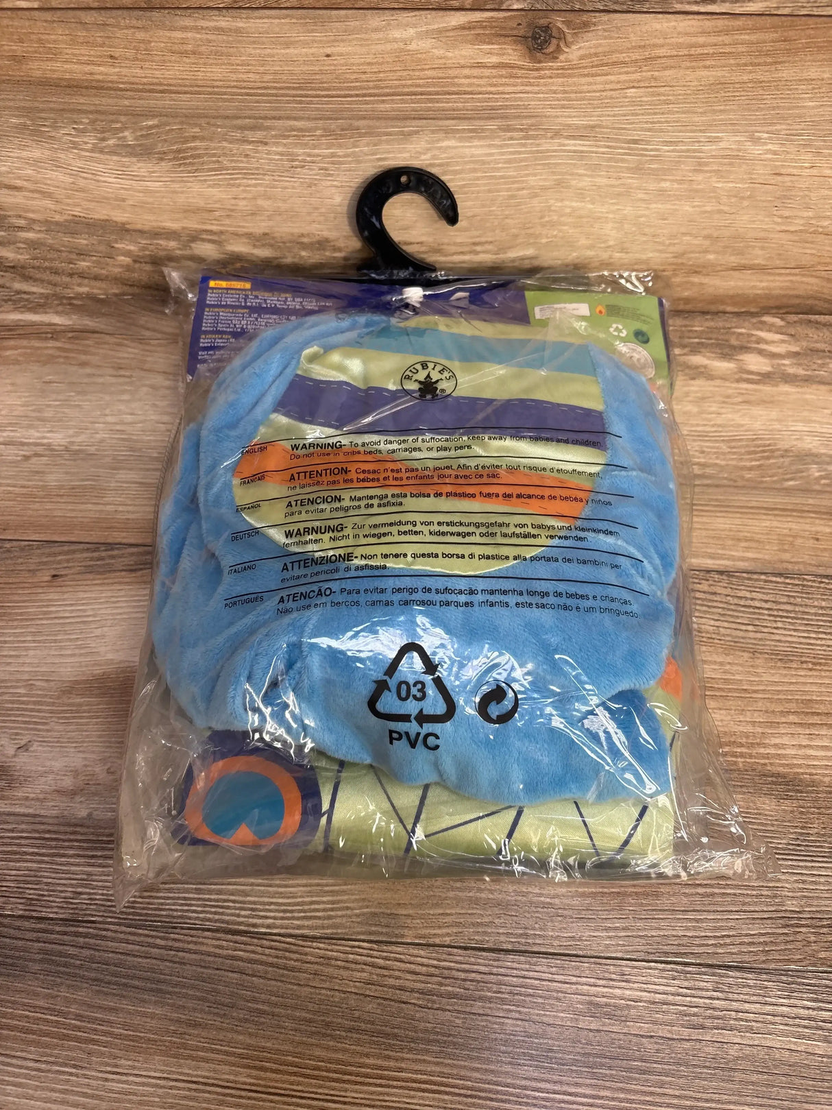 Packaged Rubie’s blue peacock costume, size 0 to 6 months, on a hanger