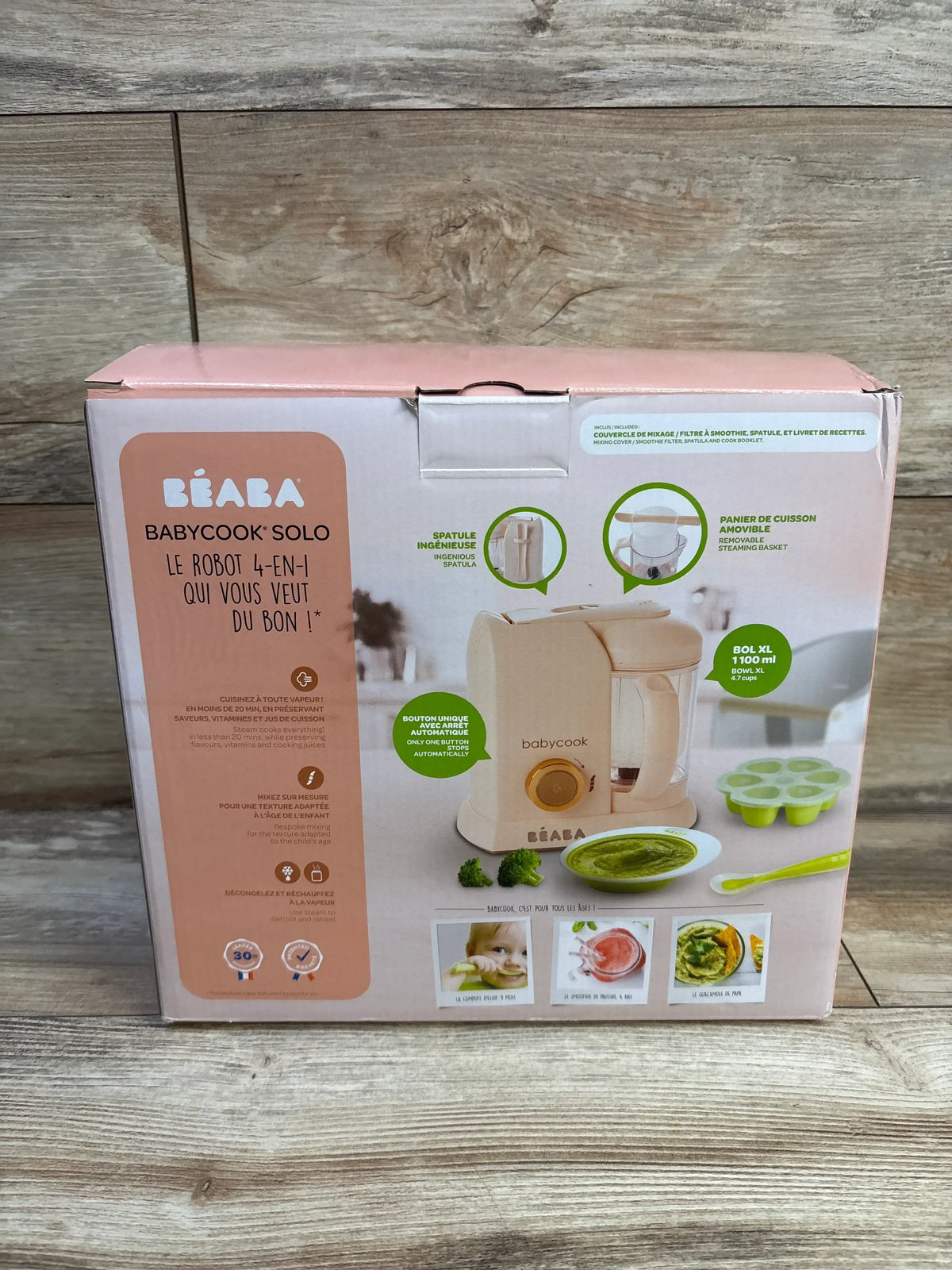 Rose gold Beaba Babycook Solo food processor packaging with appliance, steaming basket, spatula, and 1100 ml bowl