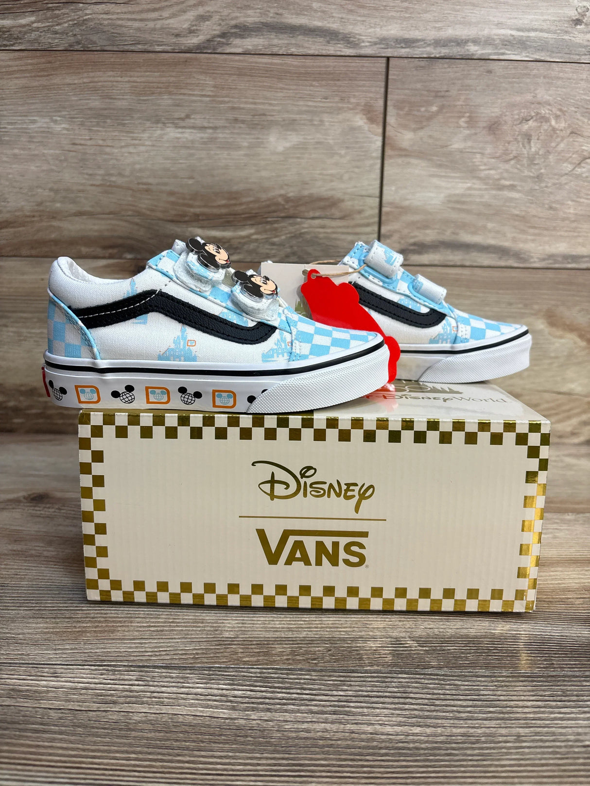 Disney Vans kids sneakers with Mickey Mouse design, blue checkered pattern, and gold box