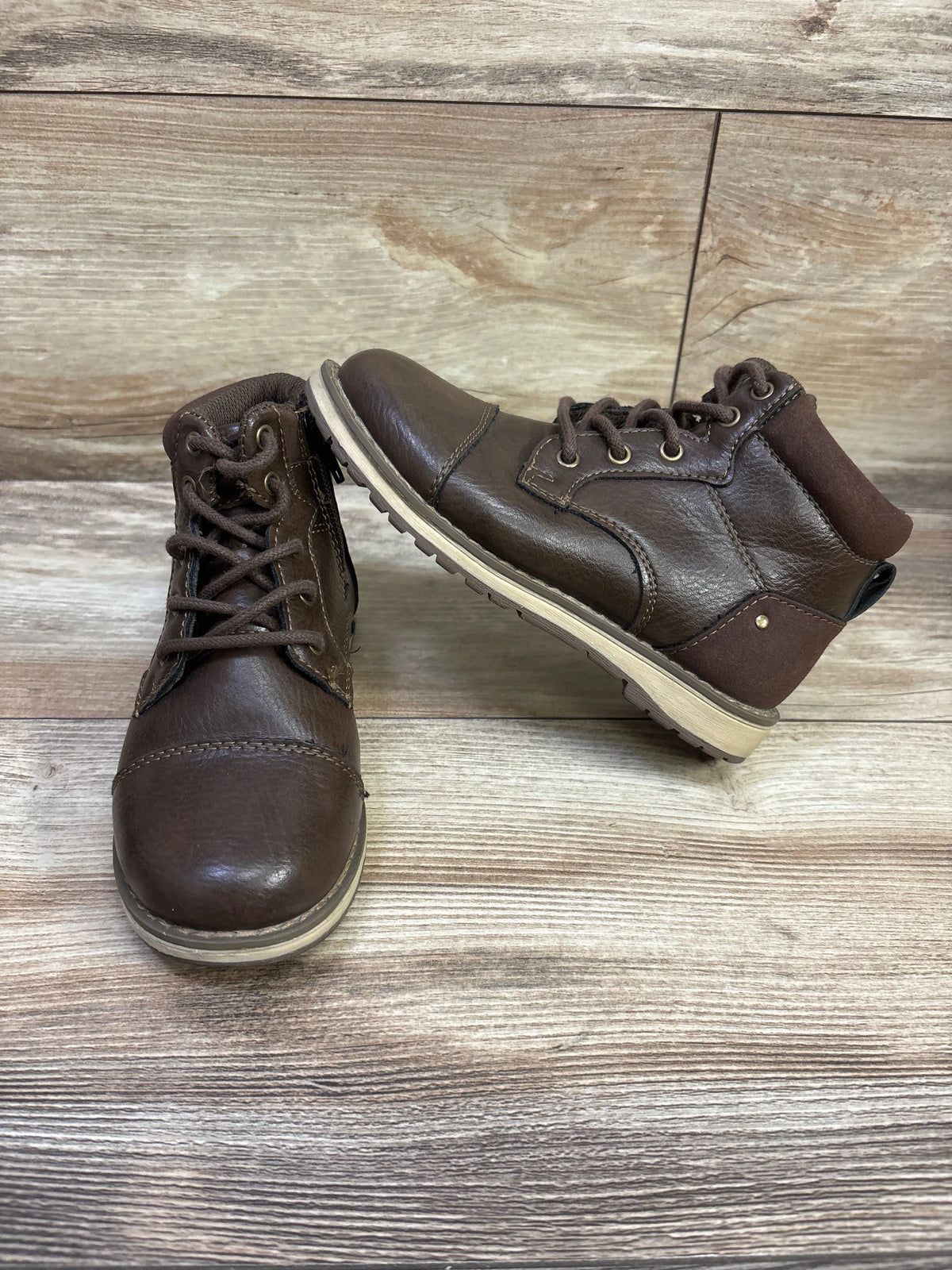 Front and side views of Sonoma Goods for Life Joshua lace-up boots showcasing brown lace-up design with wood background