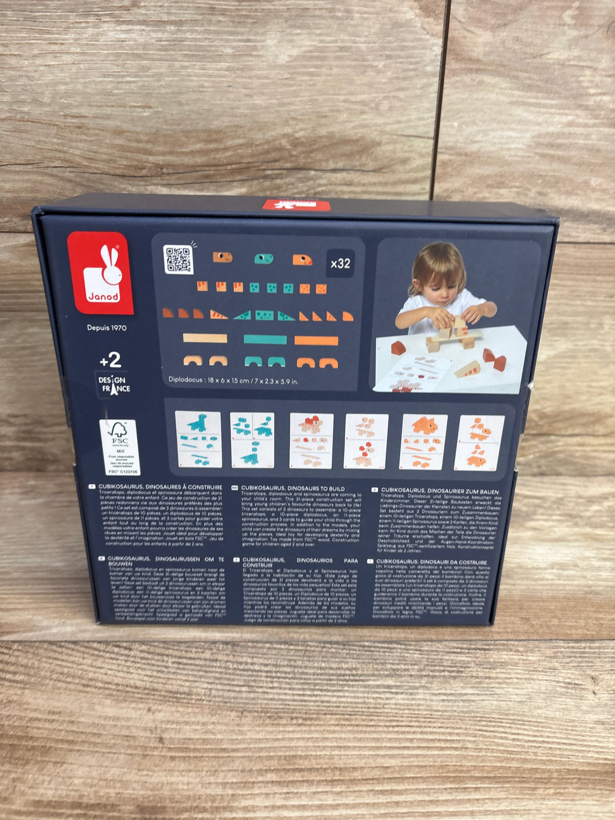 Janod Diplodocus wooden dinosaur building toy box for kids 2+, child assembling blocks on table