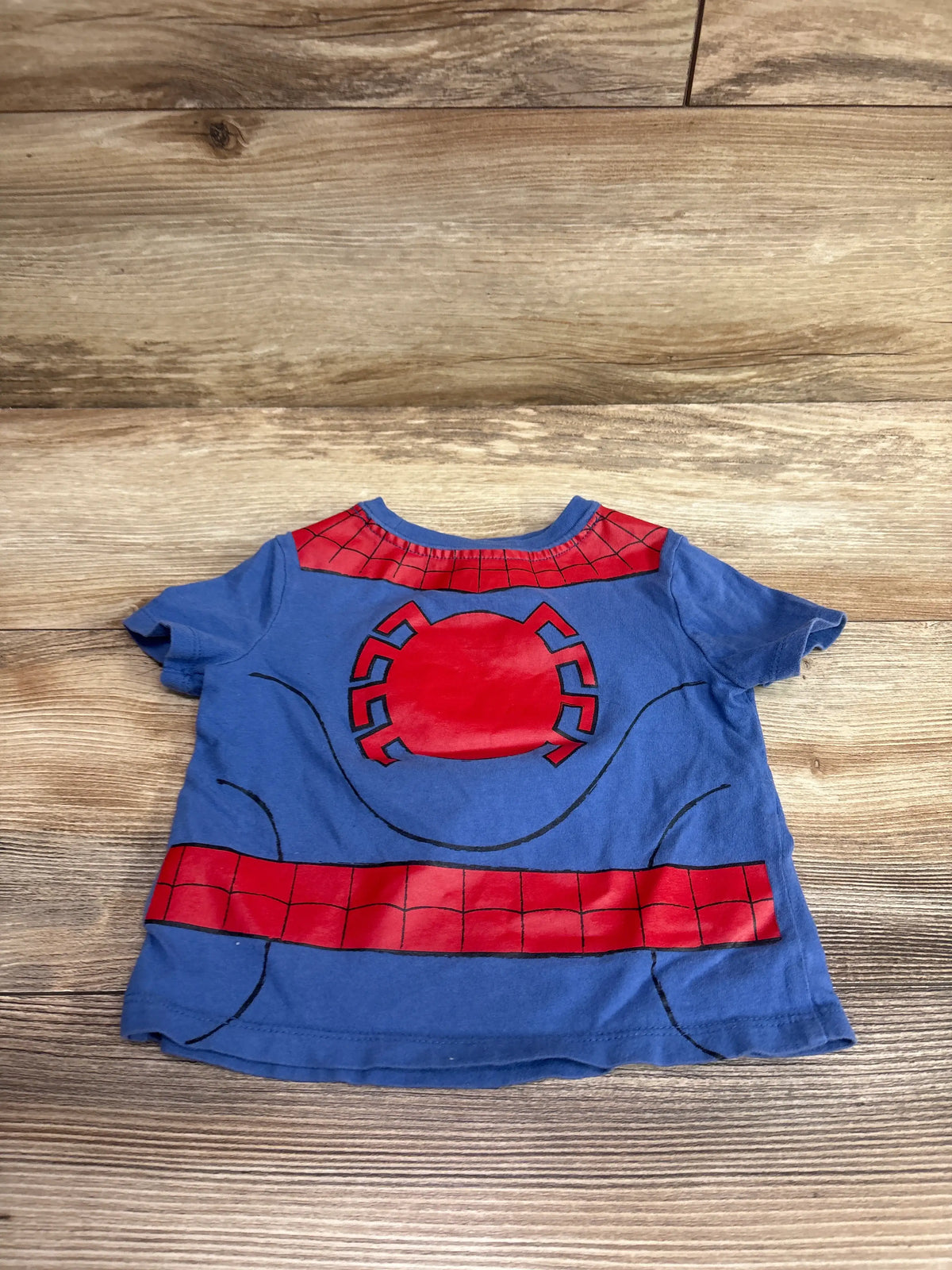 Blue Old Navy x Marvel Spider-Man shirt for babies size 12-18m on a wooden background.