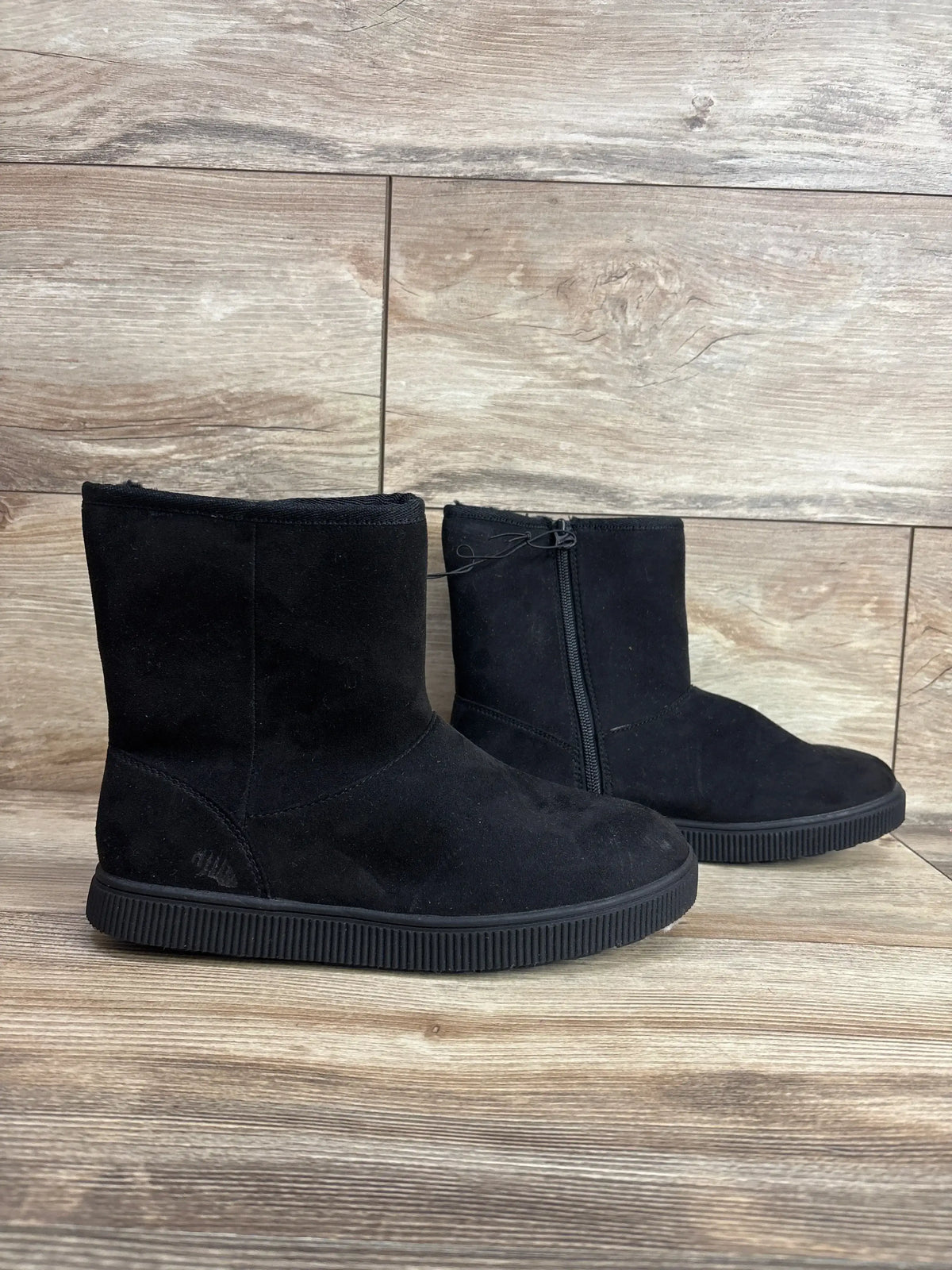 Side view of Cat & Jack Holland boots, kids’ black suede ankle, size 4Y, showing side zipper on wood floor
