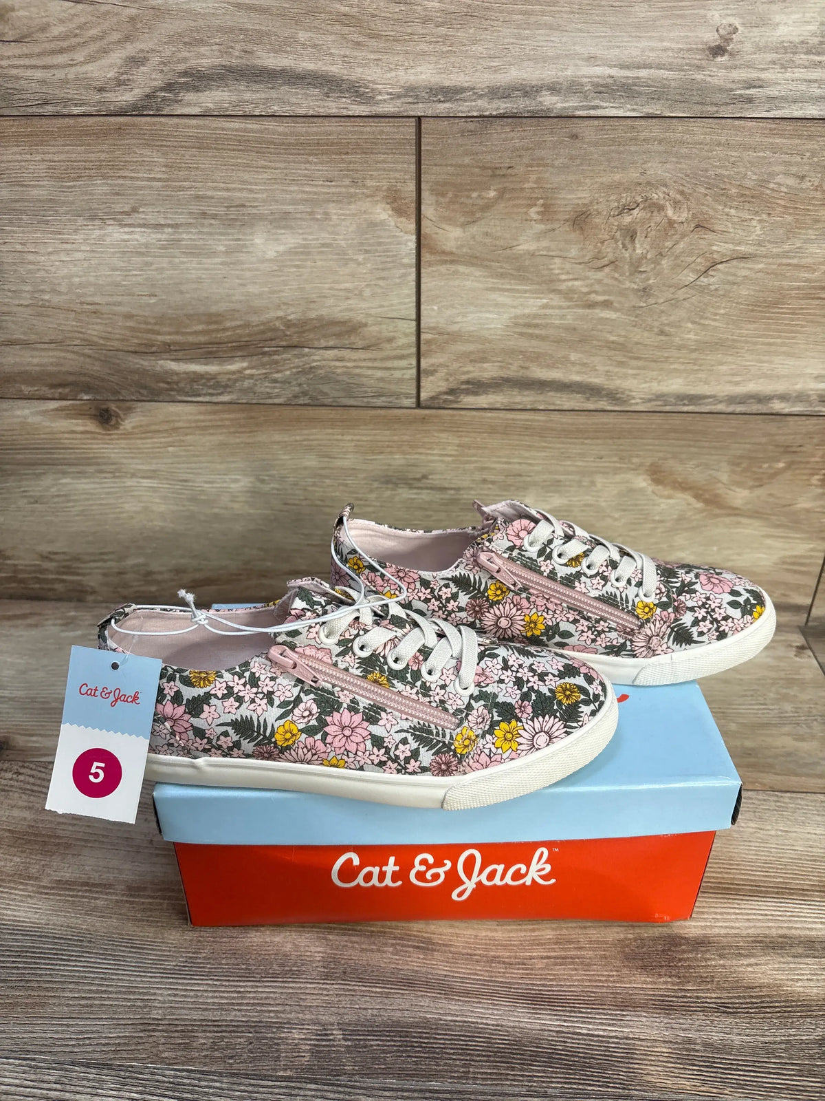 Side view of Cat and Jack Lucian double zipper floral sneakers, pink print and white laces, size 5 tag on shoebox