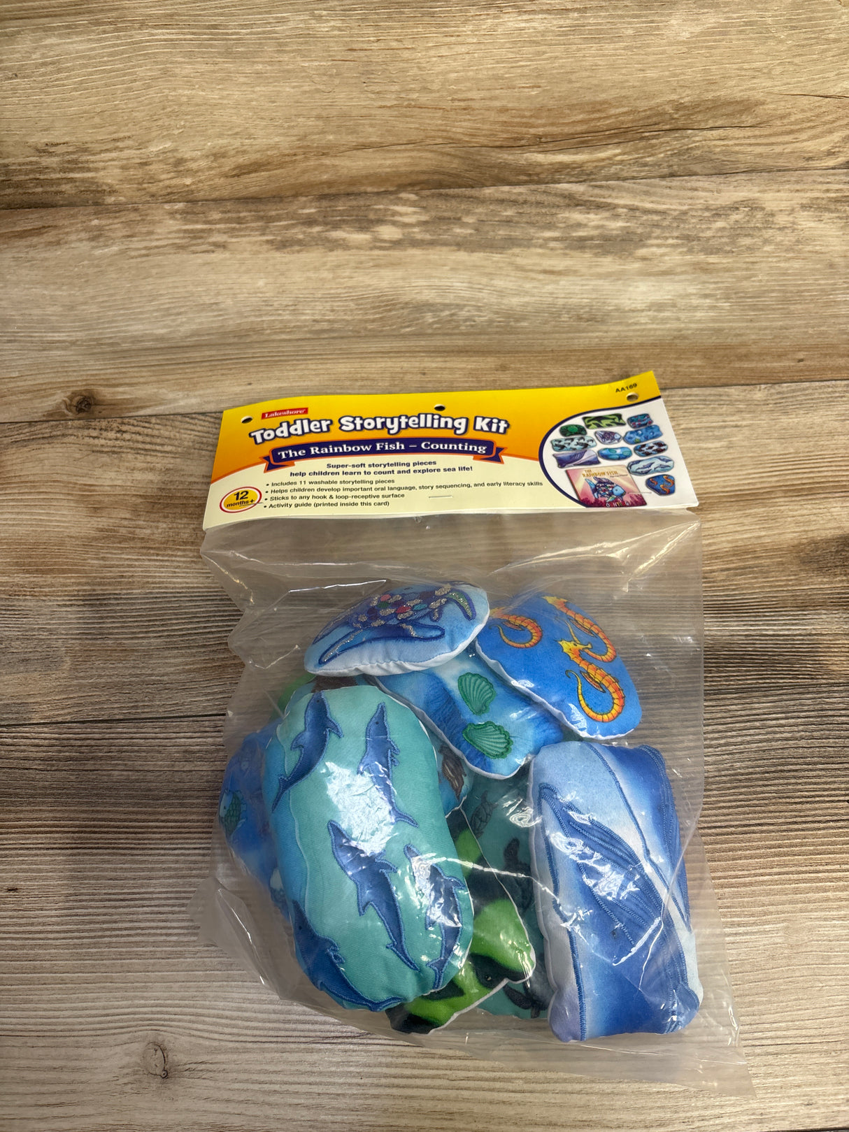 Toddler Storytelling Kit The Rainbow Fish Counting with soft, washable sea animal pieces in clear packaging