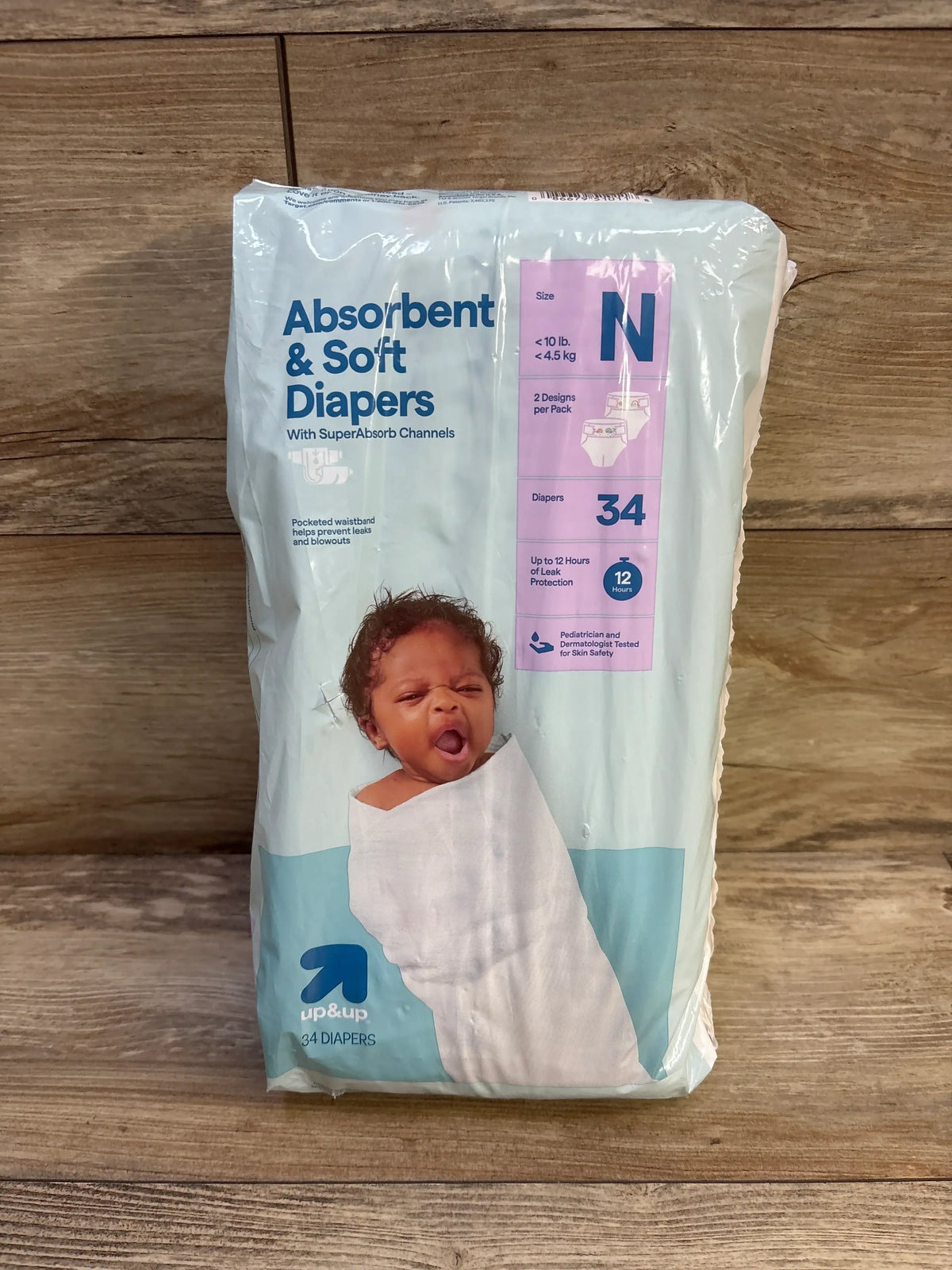 Package of Me n Mommy To Be absorbent and soft newborn diapers, 34 count.