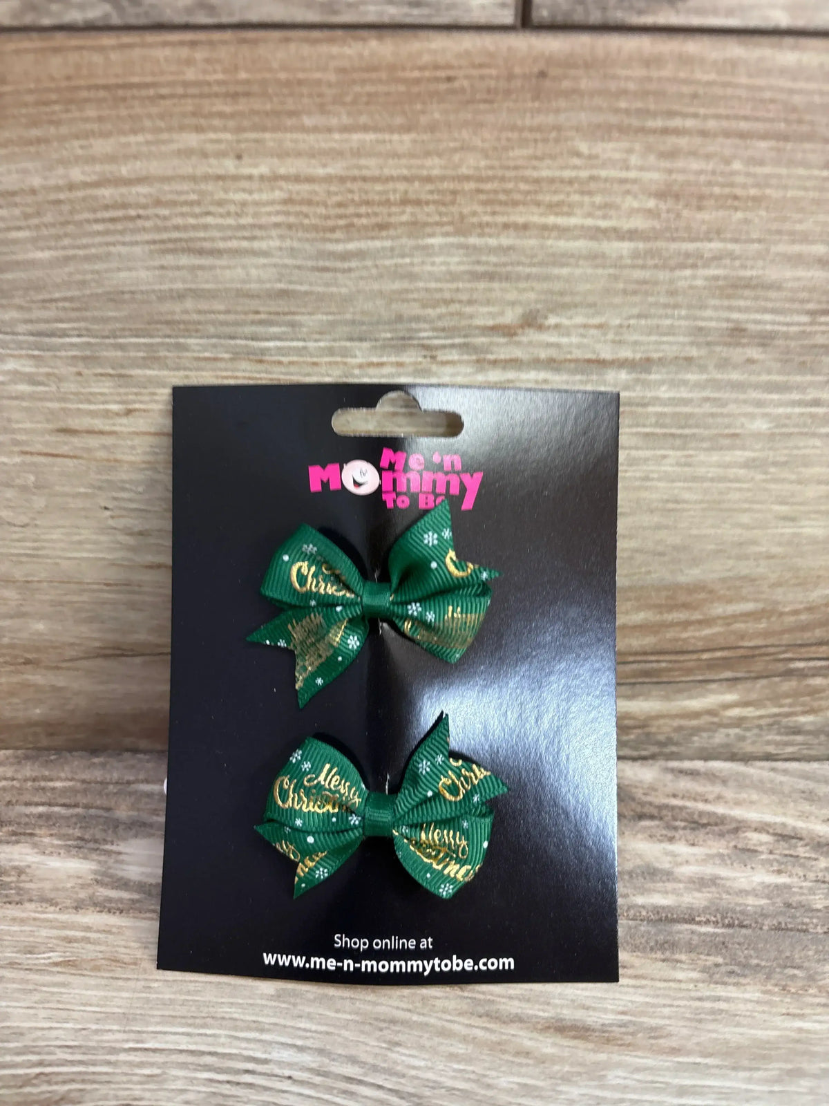 Green Christmas hair bows with gold text, perfect for kids' holiday outfits