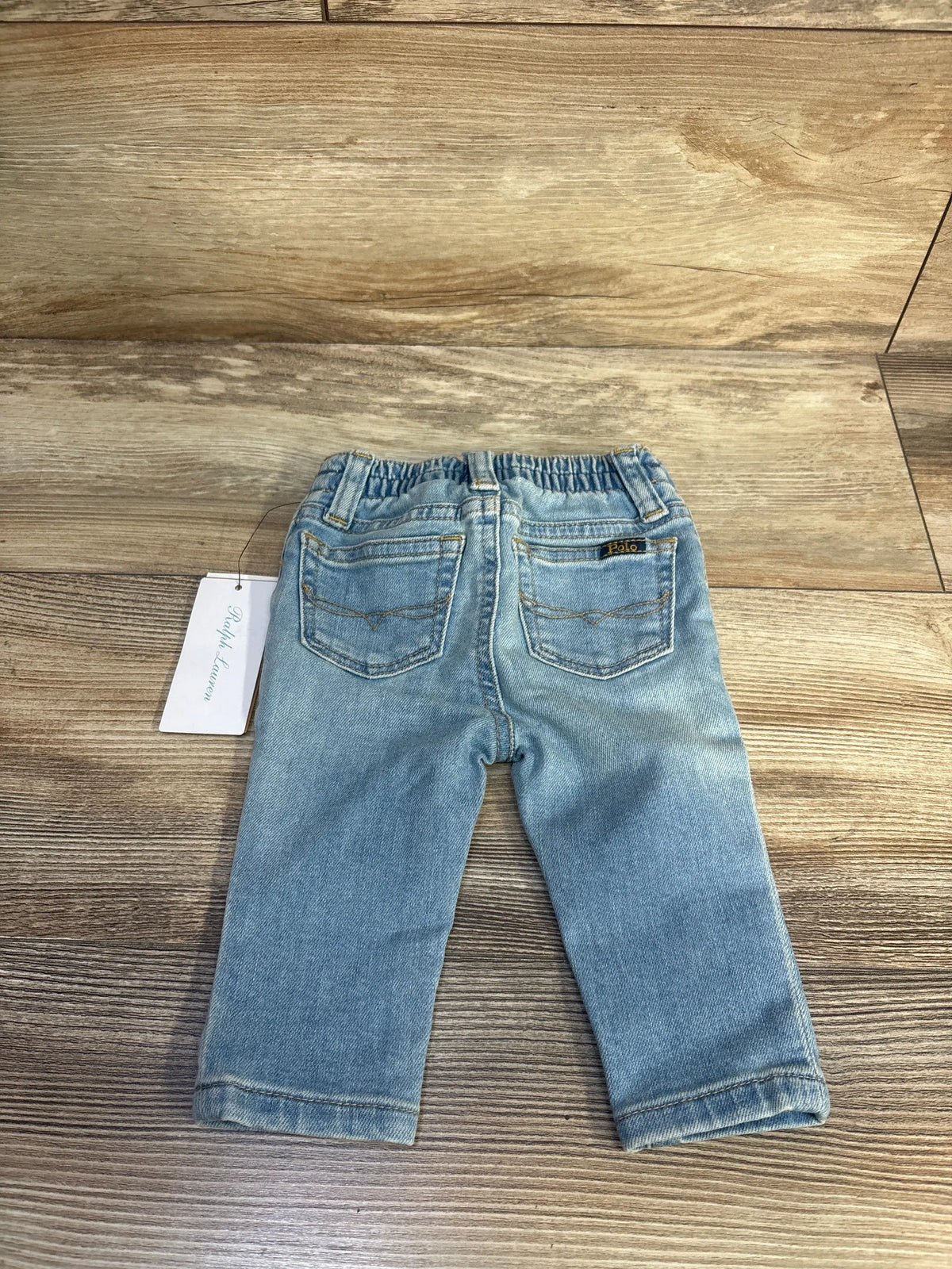 Rear view of Polo Ralph Lauren blue slim stretch jeans for 6 months showing elasticized back waist and five pocket styling