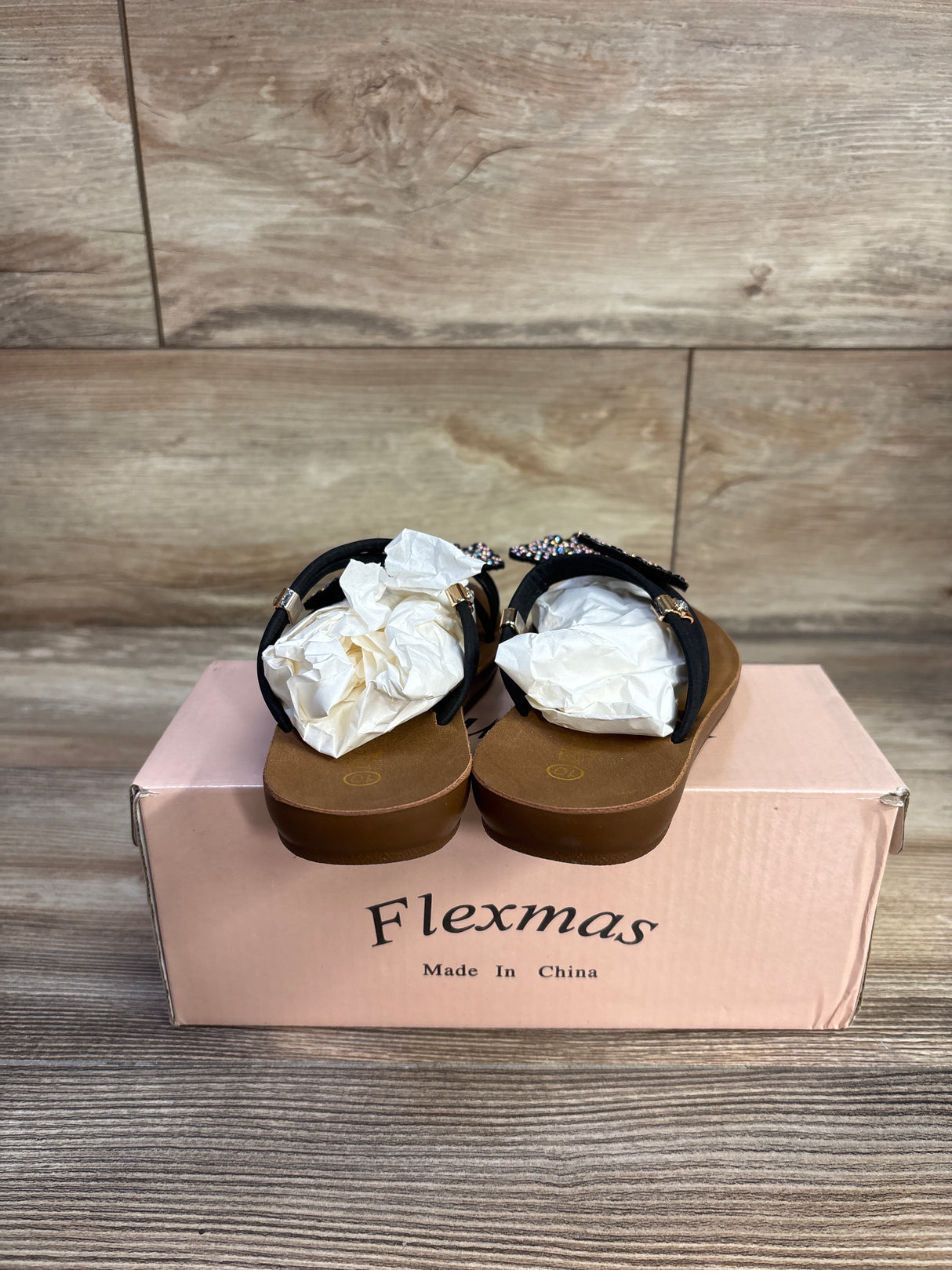Rear view of Flexmas toddler butterfly rhinestone sandals size 10C showing beaded butterfly straps on pink Flexmas shoe box